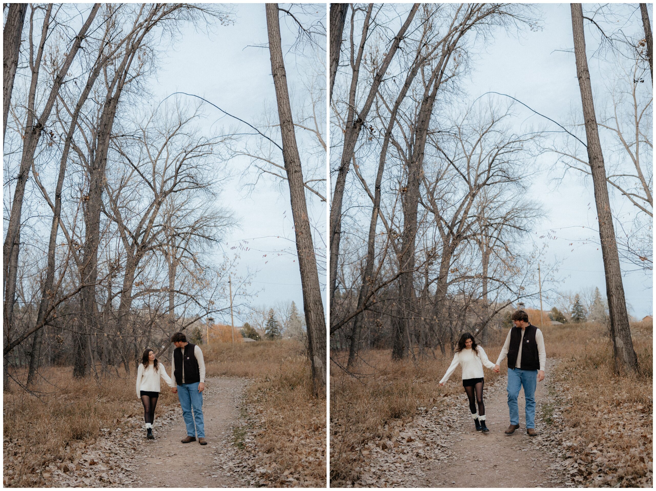 A couple walking down a treed trail.