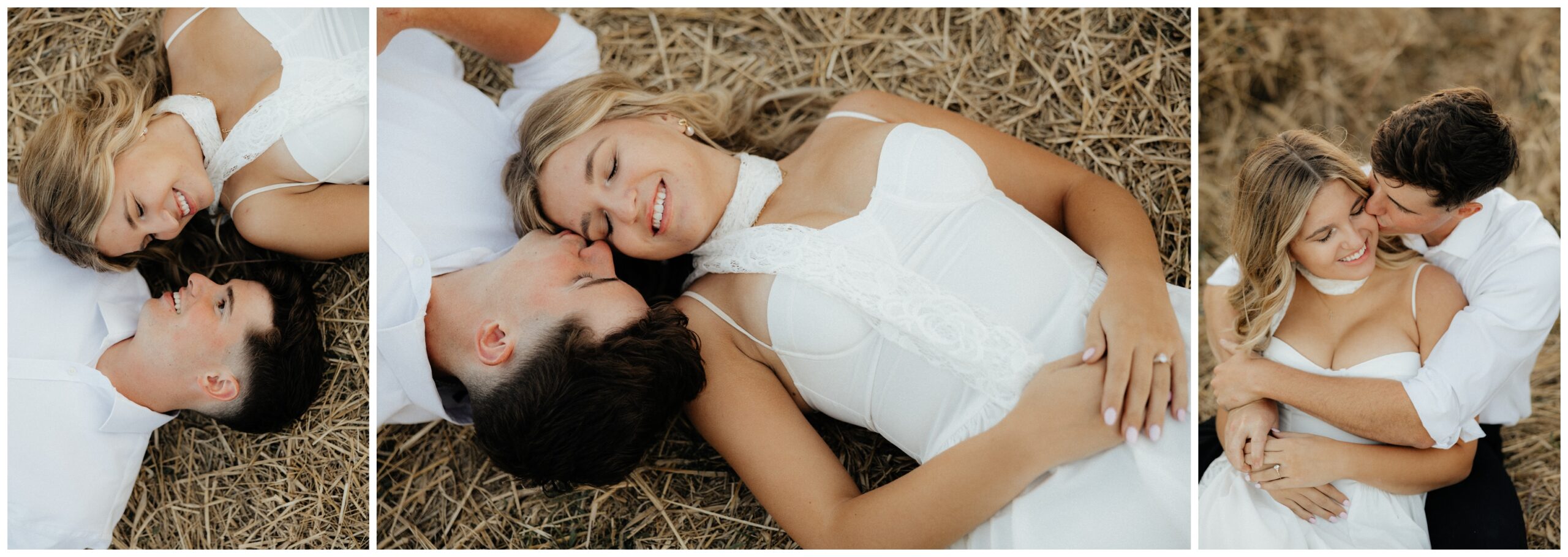 A couple laying on the ground in a grassy field.