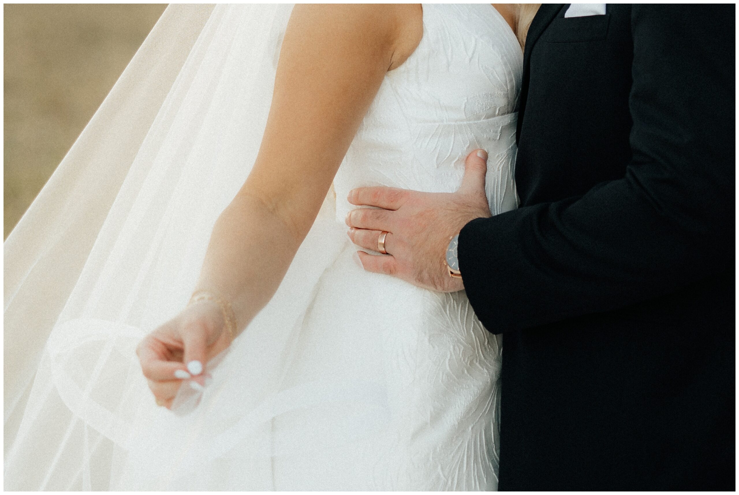 The bride and groom's hands.