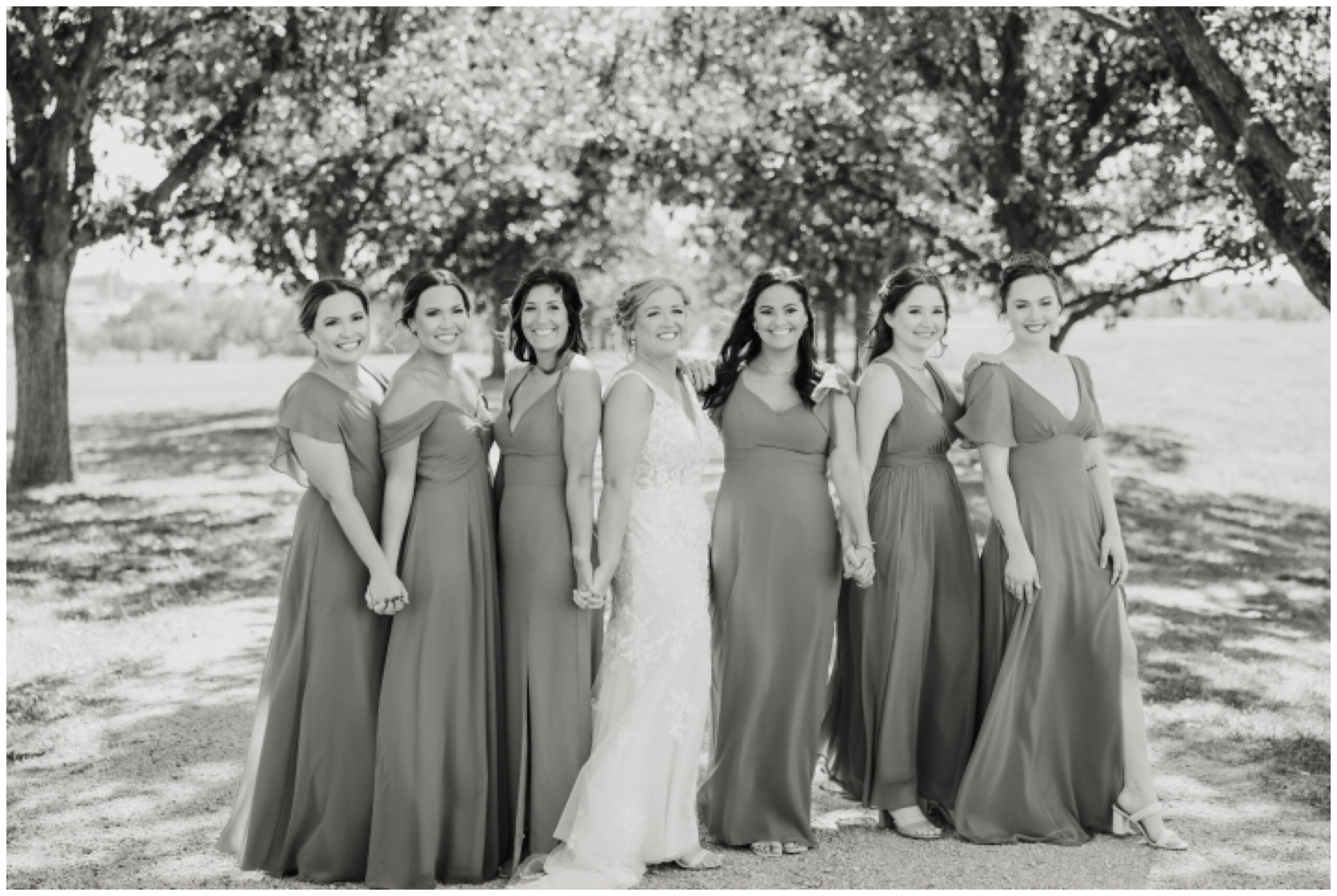 Bride and bridesmaids in vogue style pose.