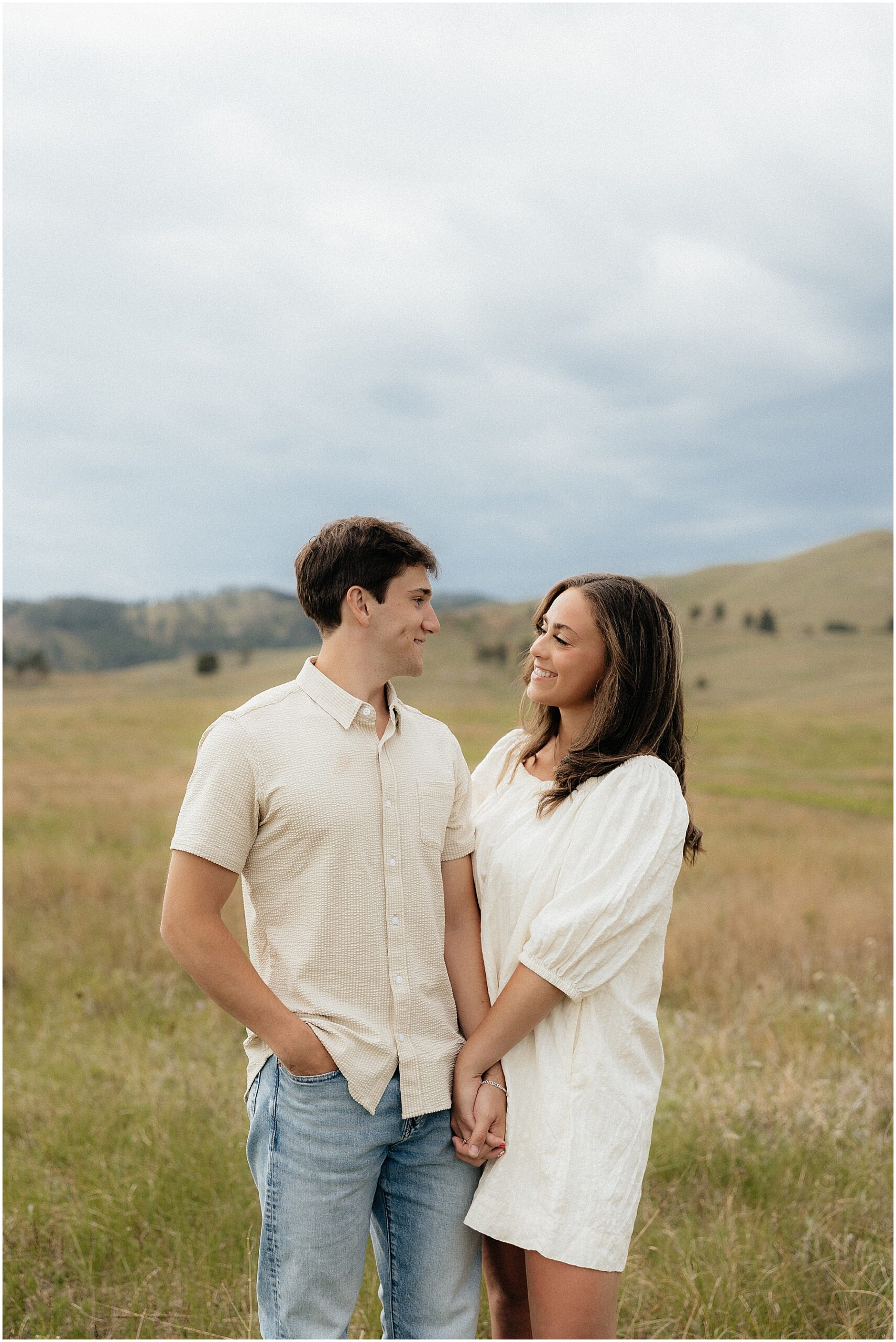 A couple smiling at each other in Wind Cave National Park.