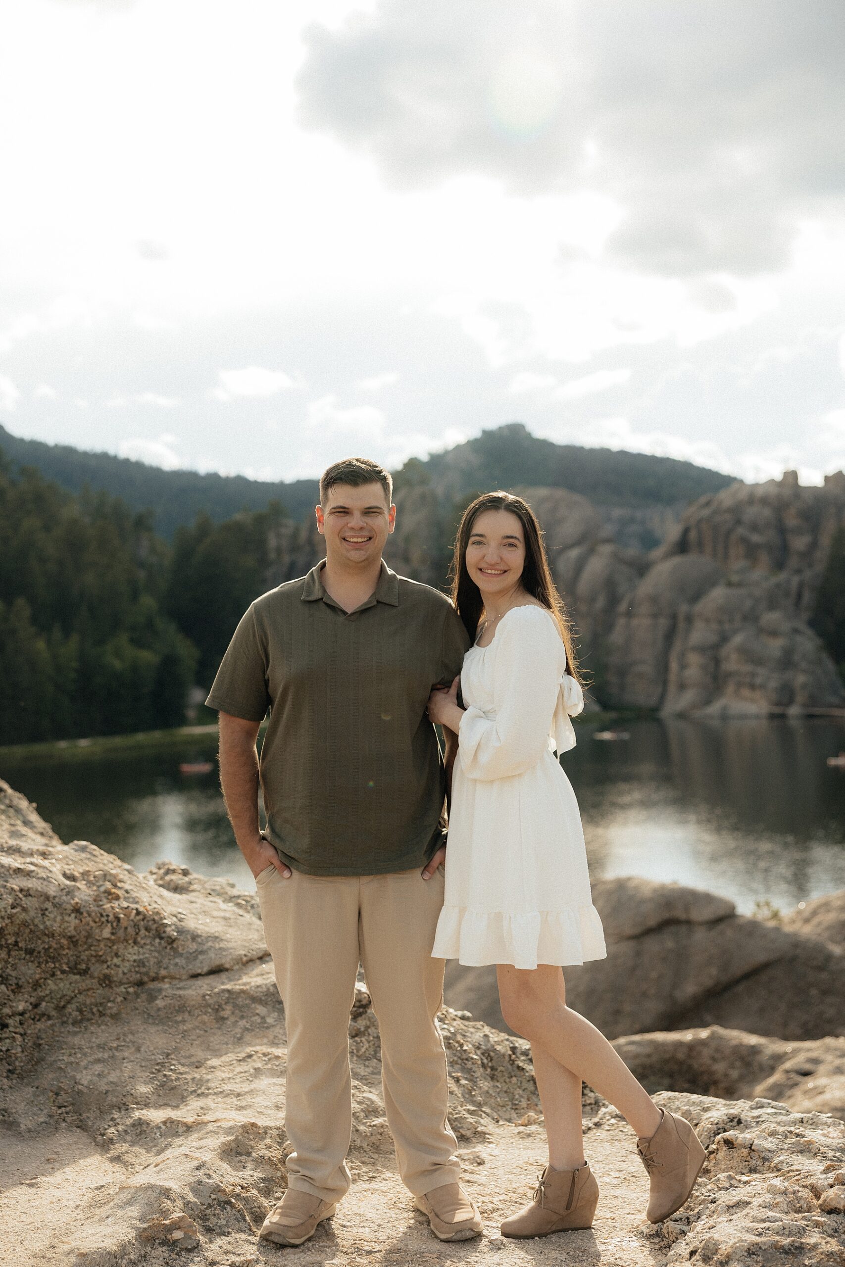 Emily and Harrison smiling at the camera at Sylvan Lake.