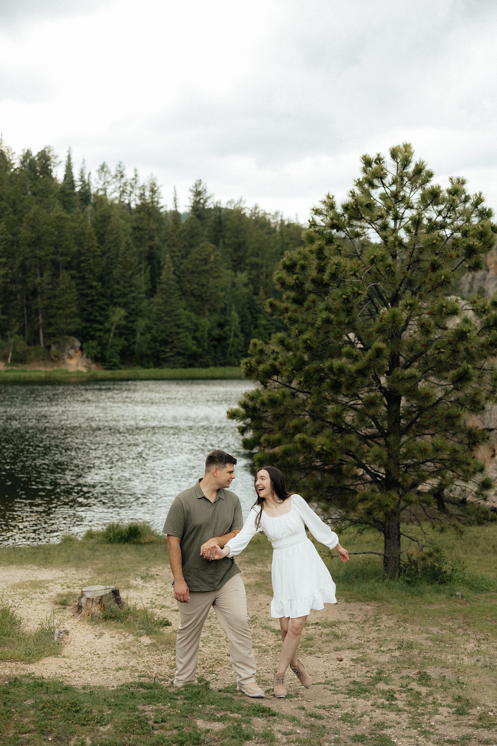 Emily and Harrison playfully walking at Sylvan Lake.