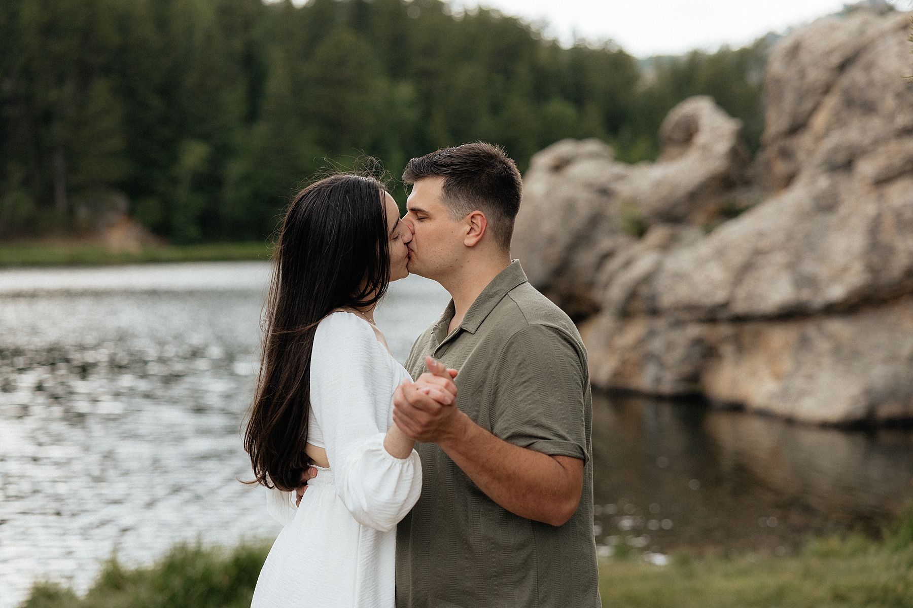 Emily + Harrison kiss while practicing their first dance.