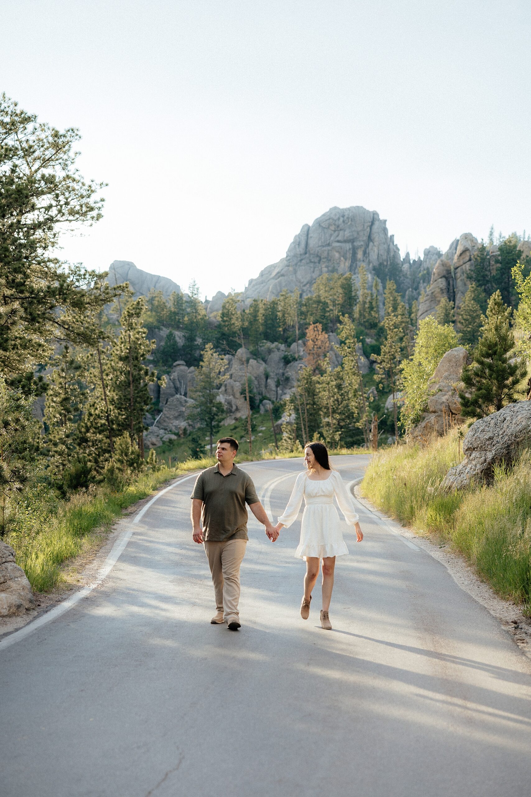 Emily and Harrison walking hand in hand while taking in the views.