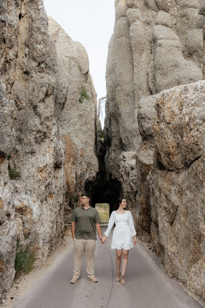 Harrison and Emily stand in Needle's Eye Tunnel.
