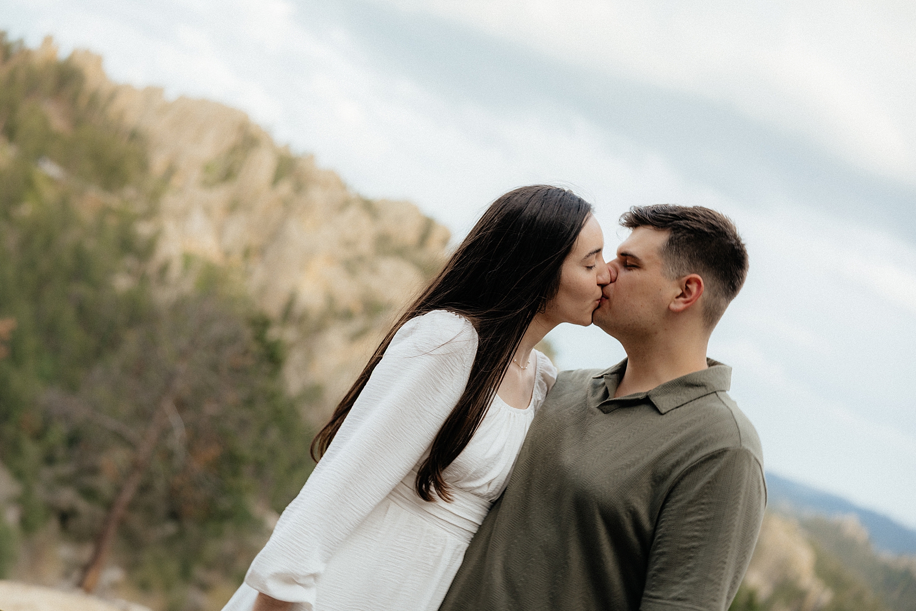 Emily + Harrison kissing on Needle's Highway.