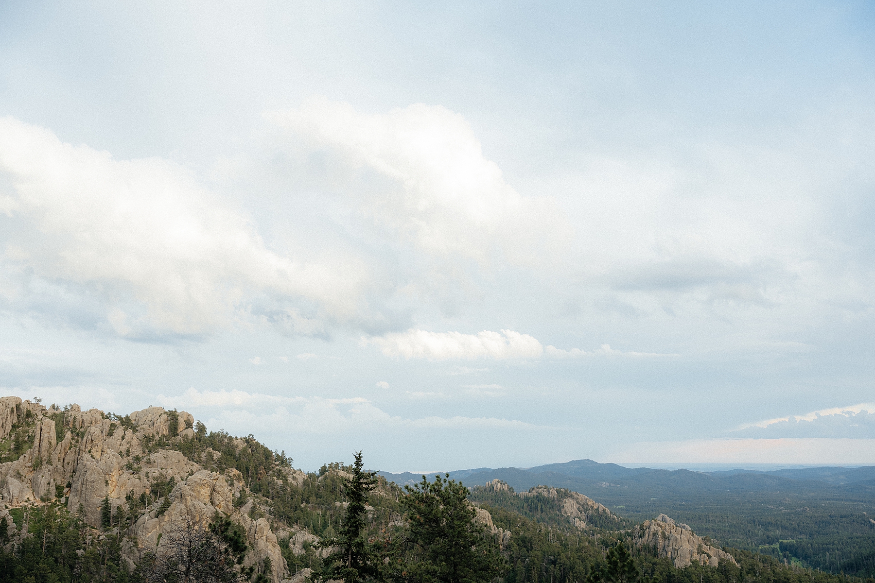 The Black Hills with rolling clouds over them.