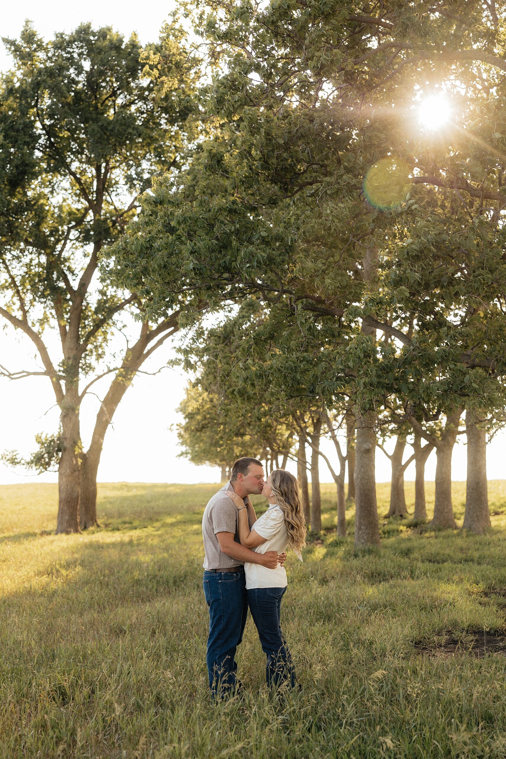 A couple kissing in a field in Brookings, SD.