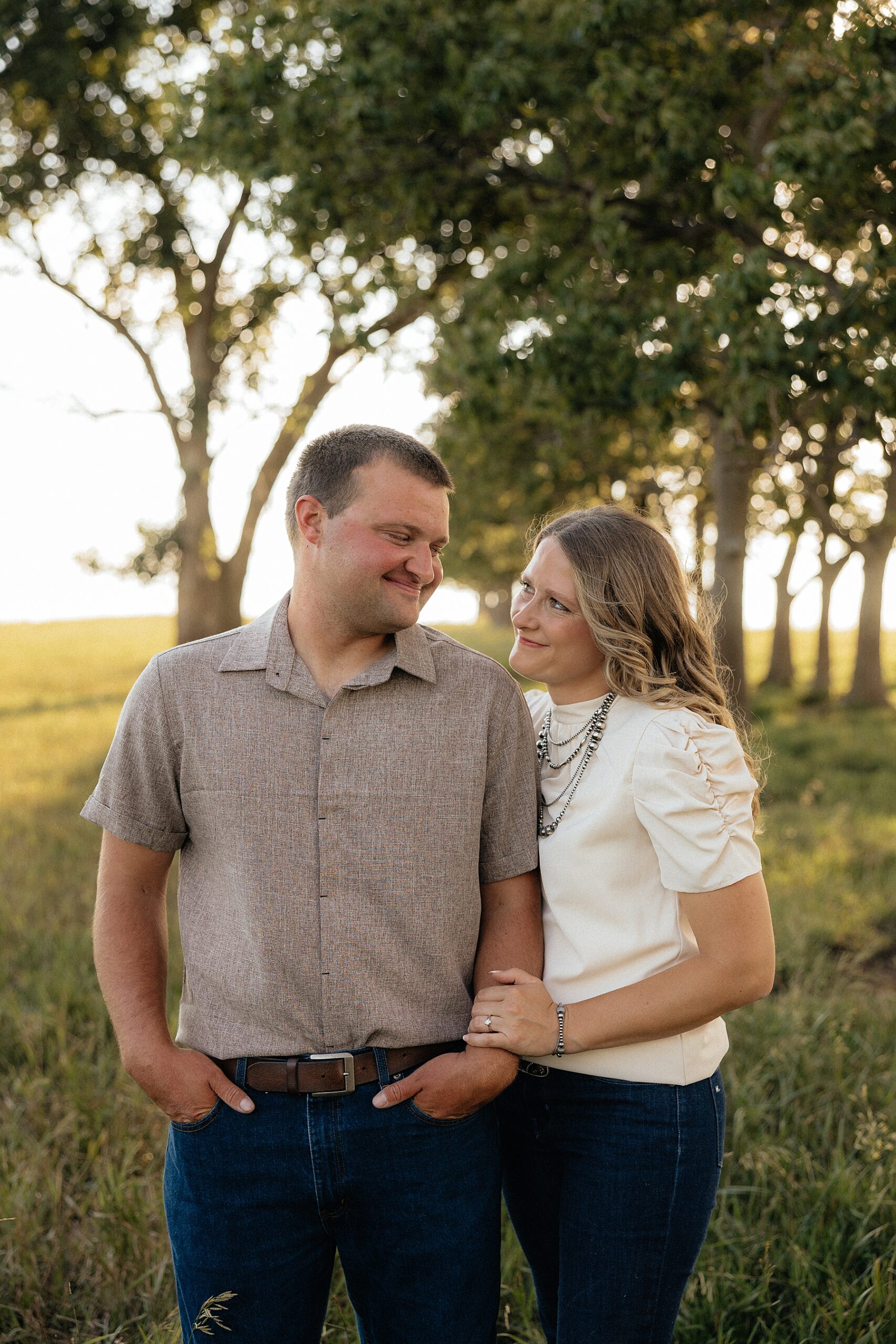 A couple smiling at each other.