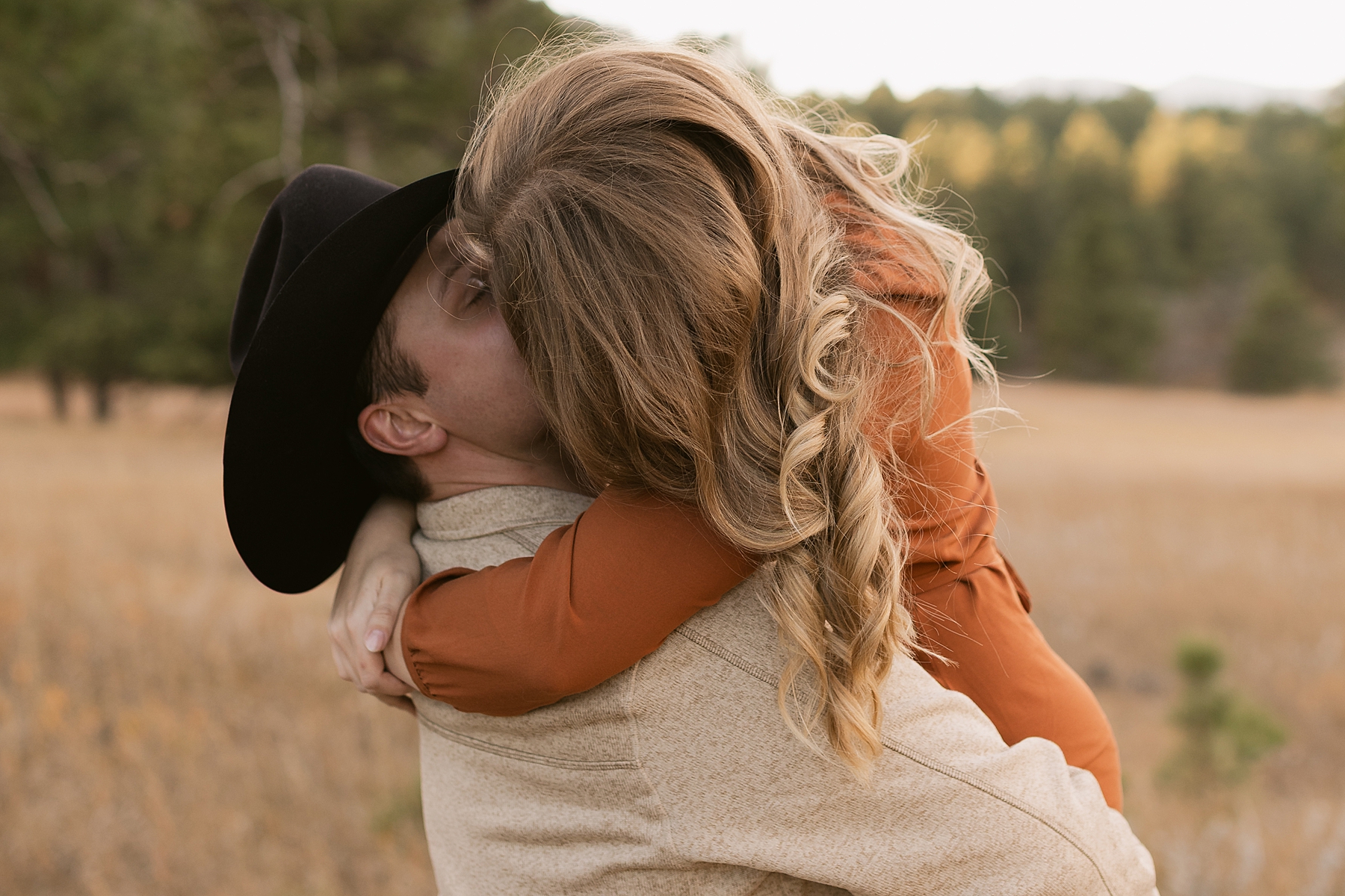 Emma kisses Jordan during their engagement session on Iron Mountain Road.