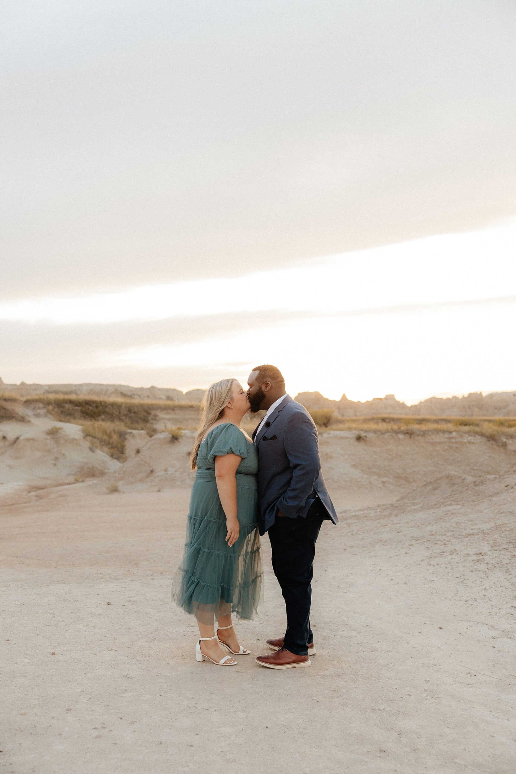 BreAnn and Kenyon kissing in Badlands National Park.