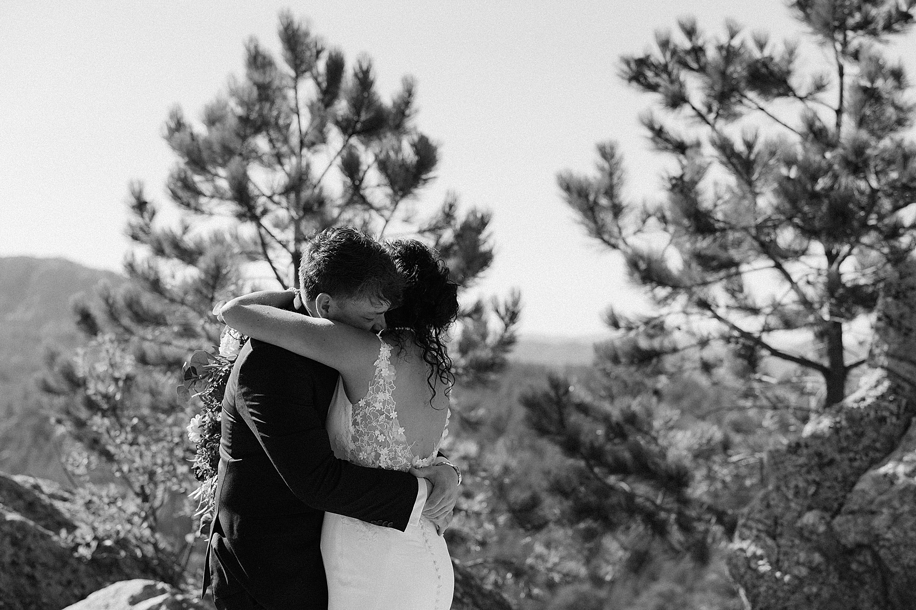 The couple embracing during the first look at their elopement in Keystone, South Dakota.