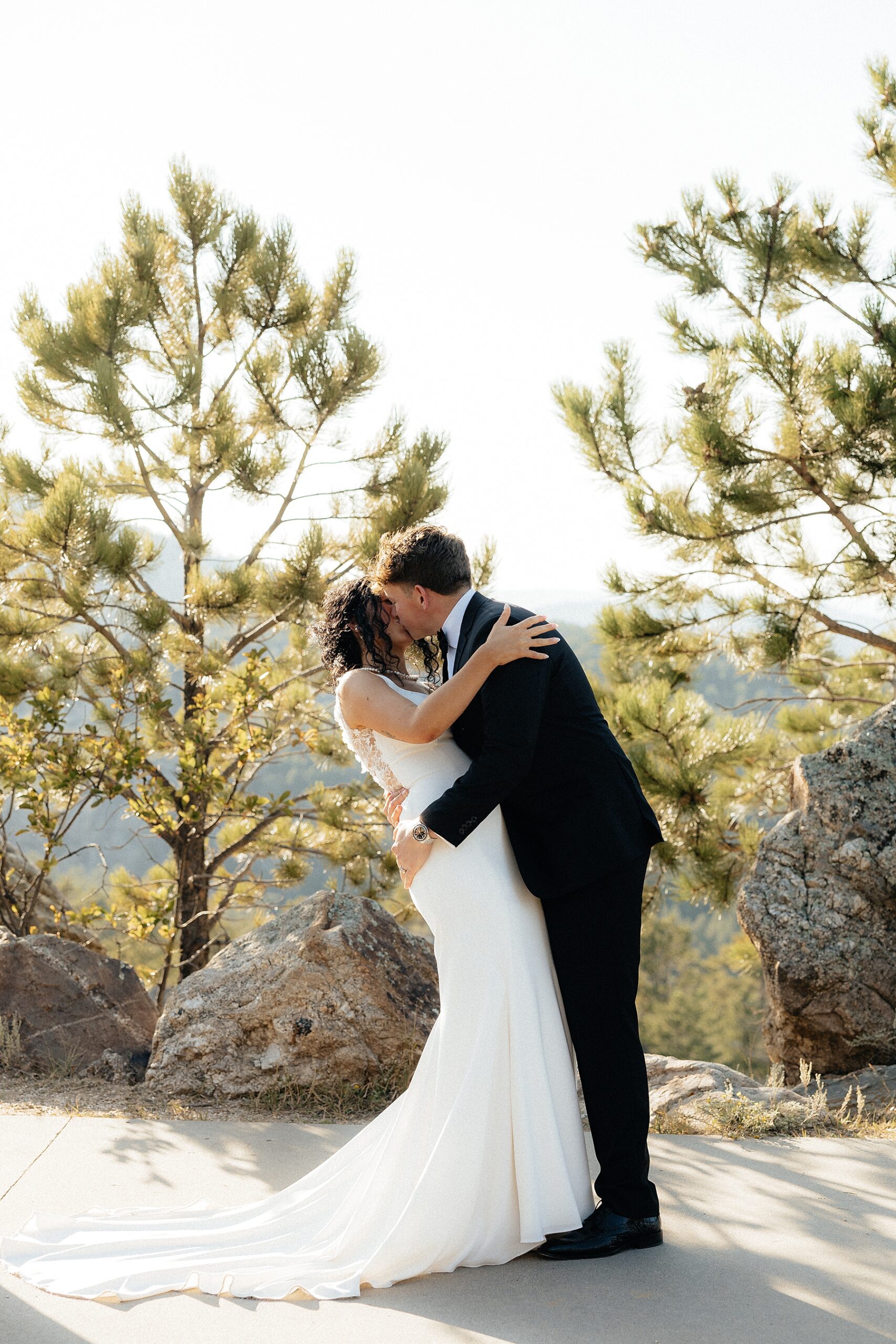The couple sharing their first kiss at their elopement in the Black Hills.