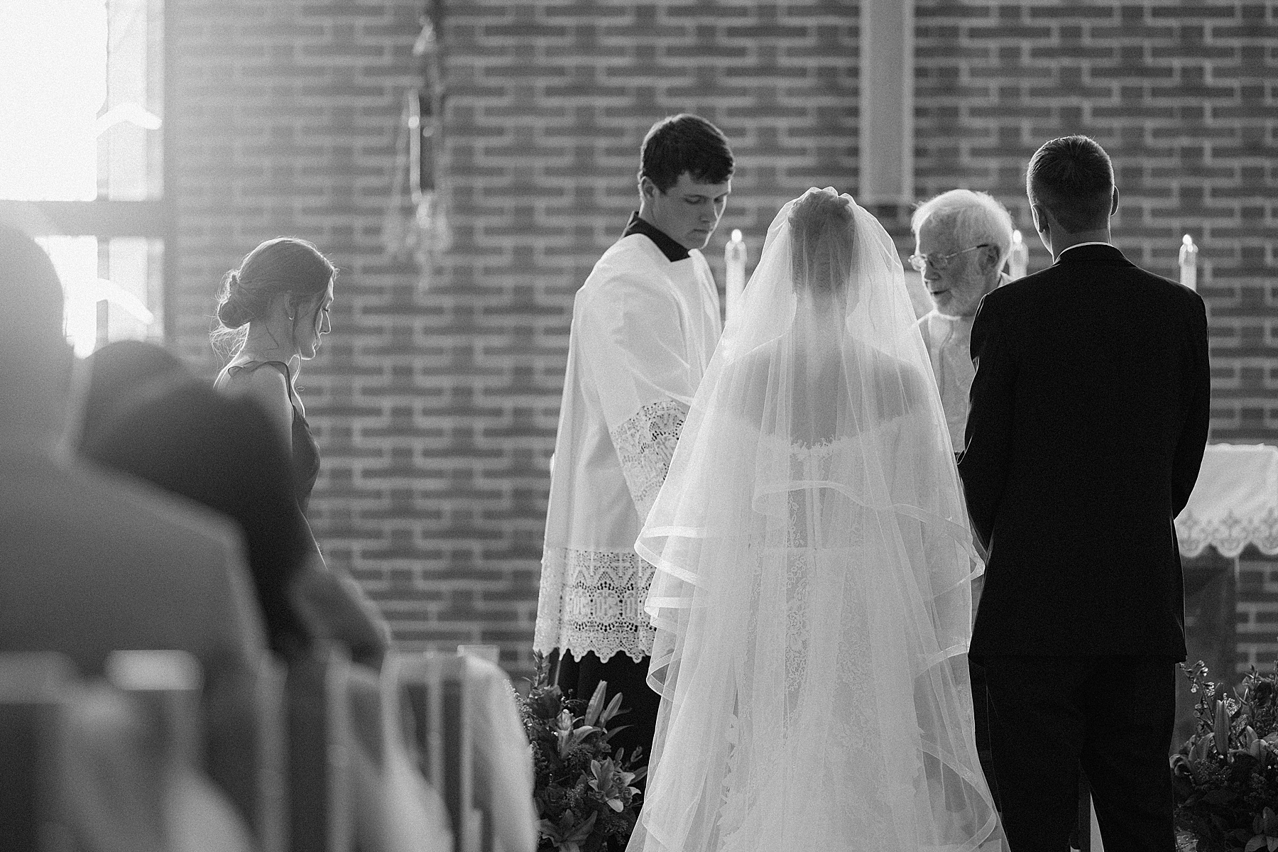 The bride and groom at the alter.