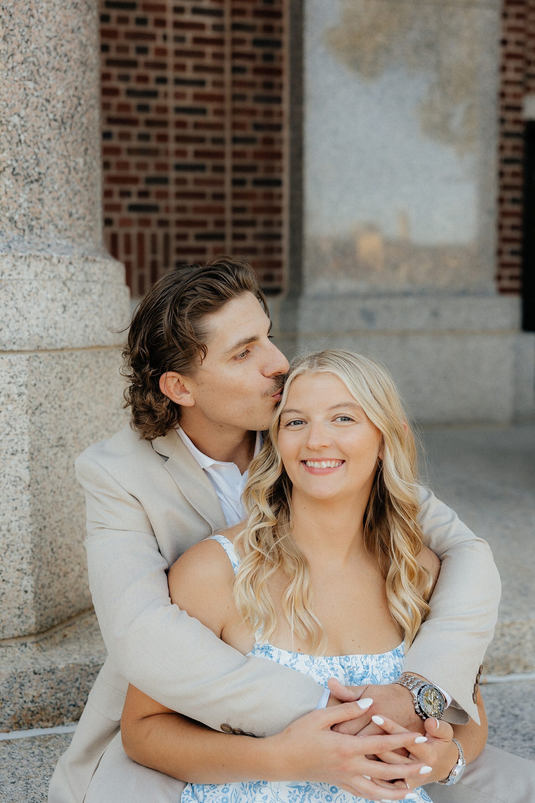 Michael kisses Karissa's forehead.