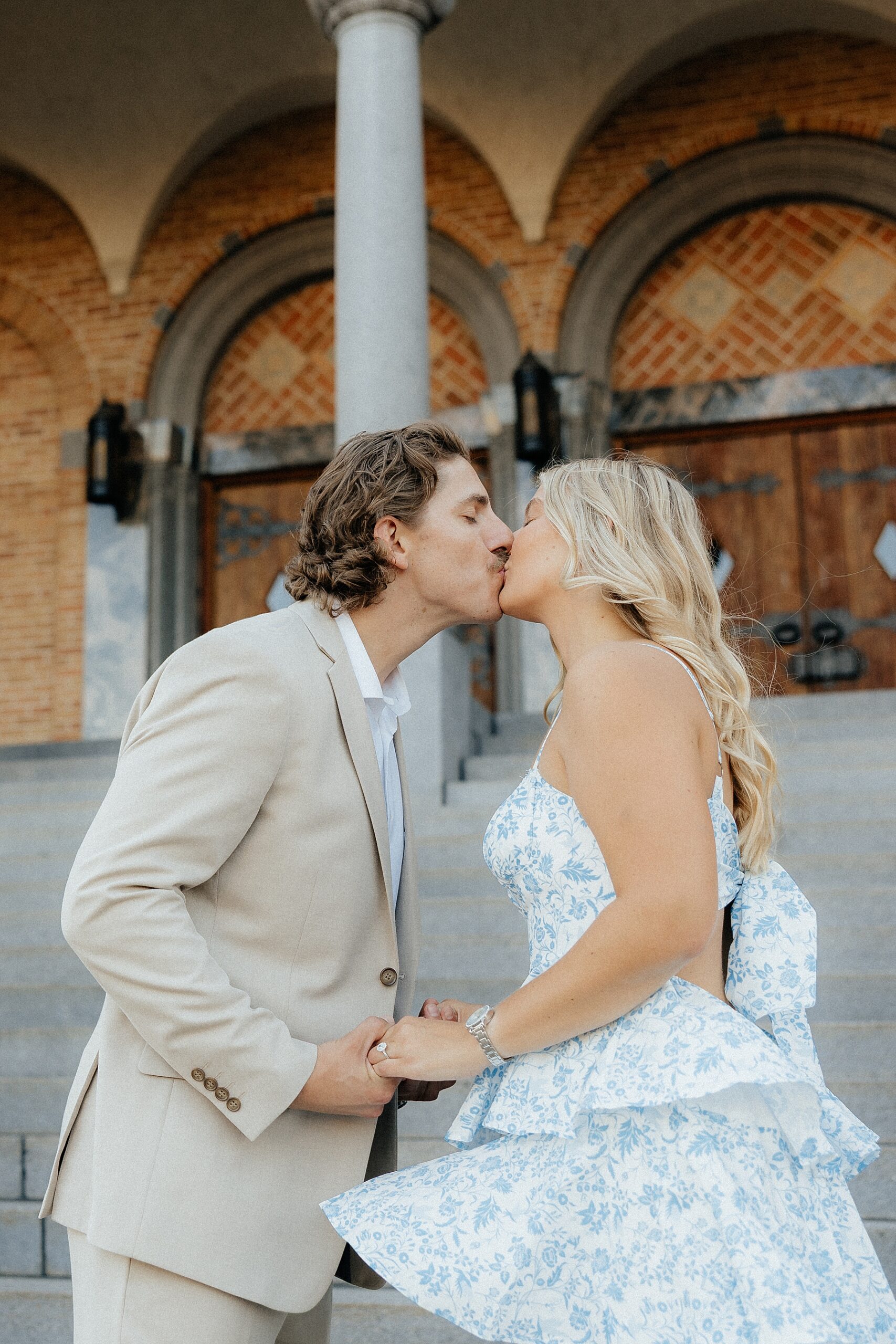Karissa and Michael kissing in front of St. Mary's Cathedral.
