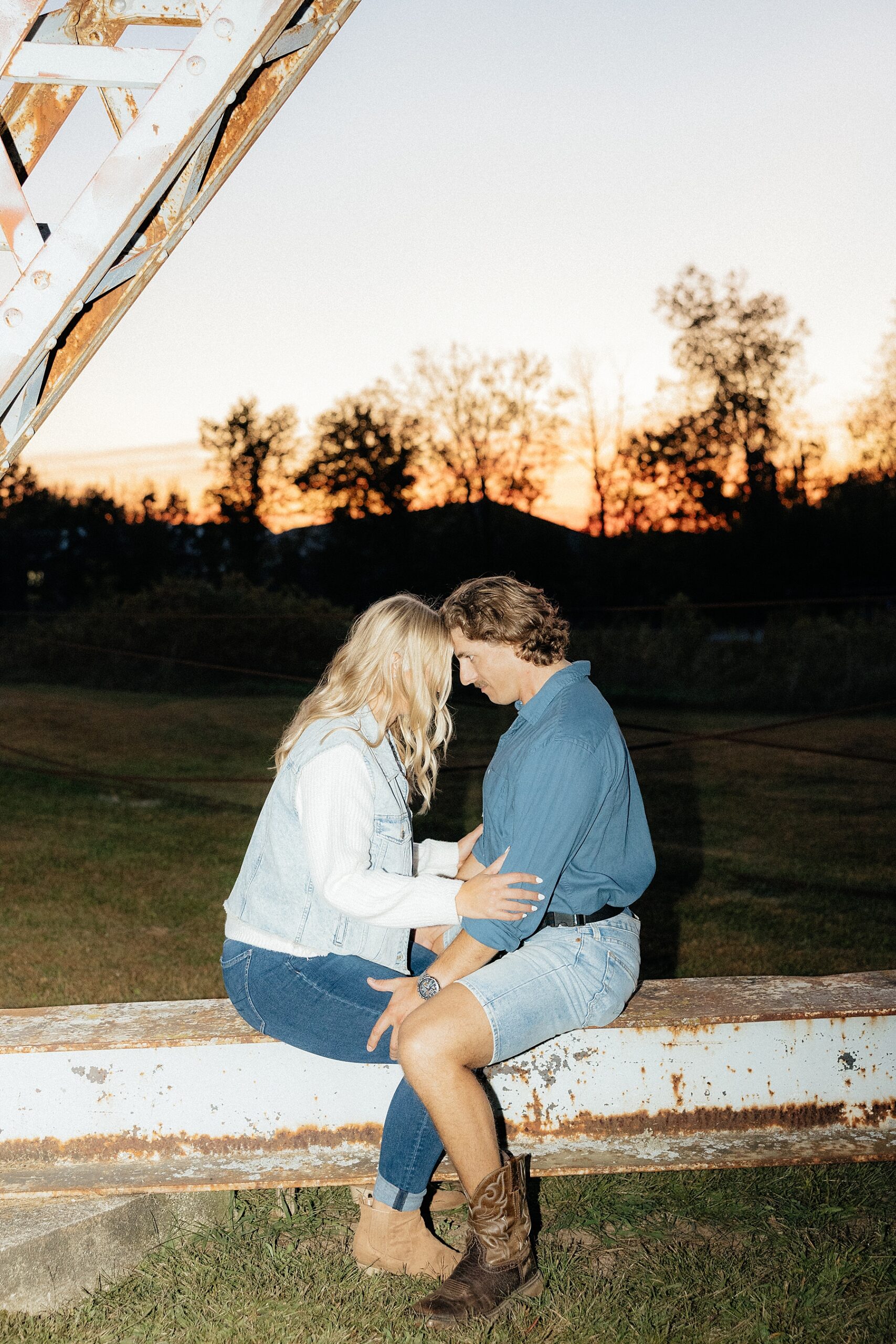 Karissa and Michael sitting forehead to forehead.