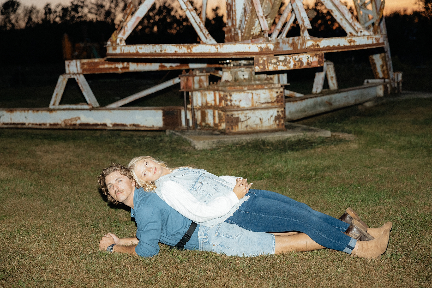 Karissa lays on Michael during their funny, Mastermind inspired engagement photos.