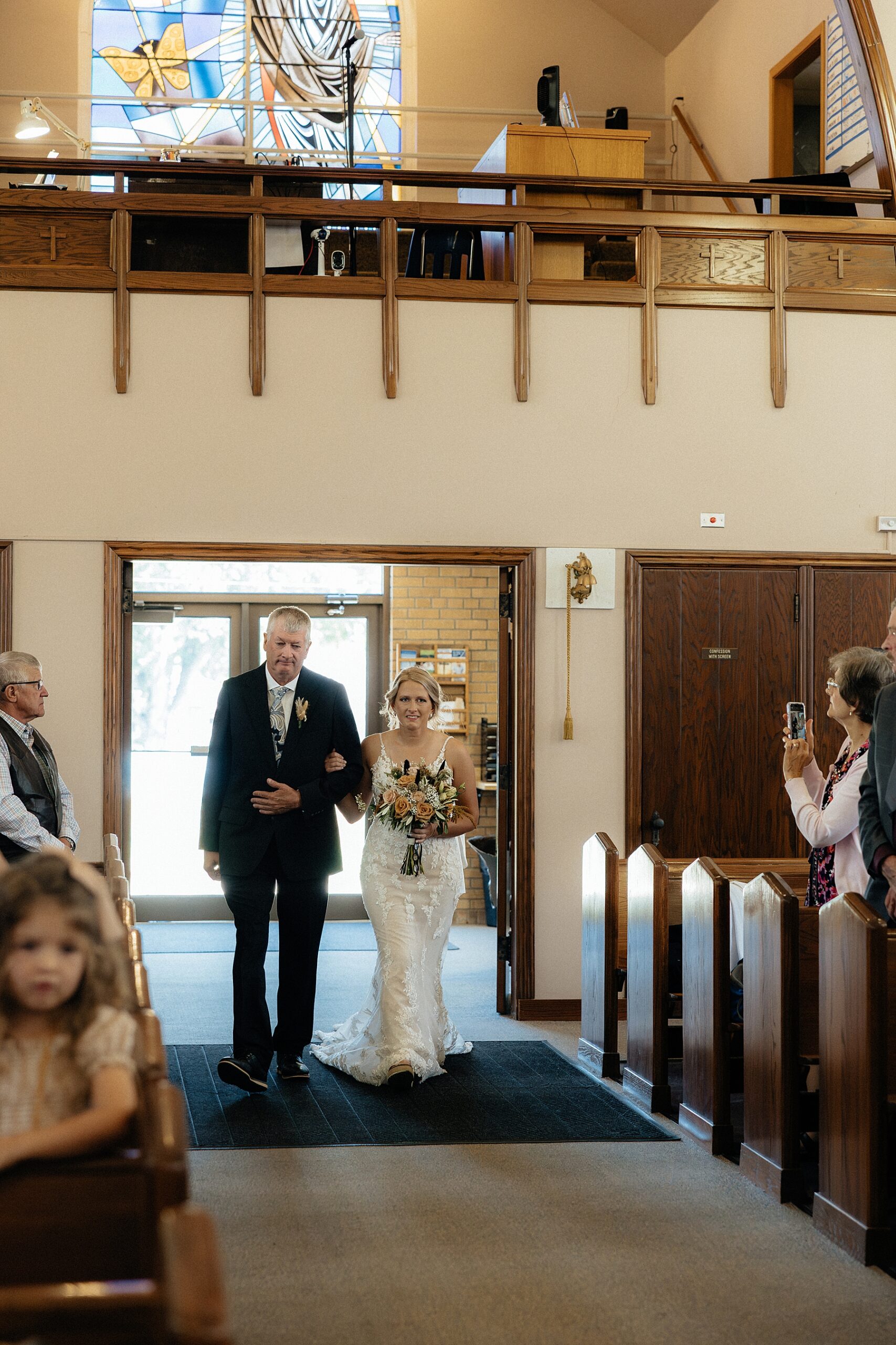 Bride walking down the aisle at St. Mary Catholic Church