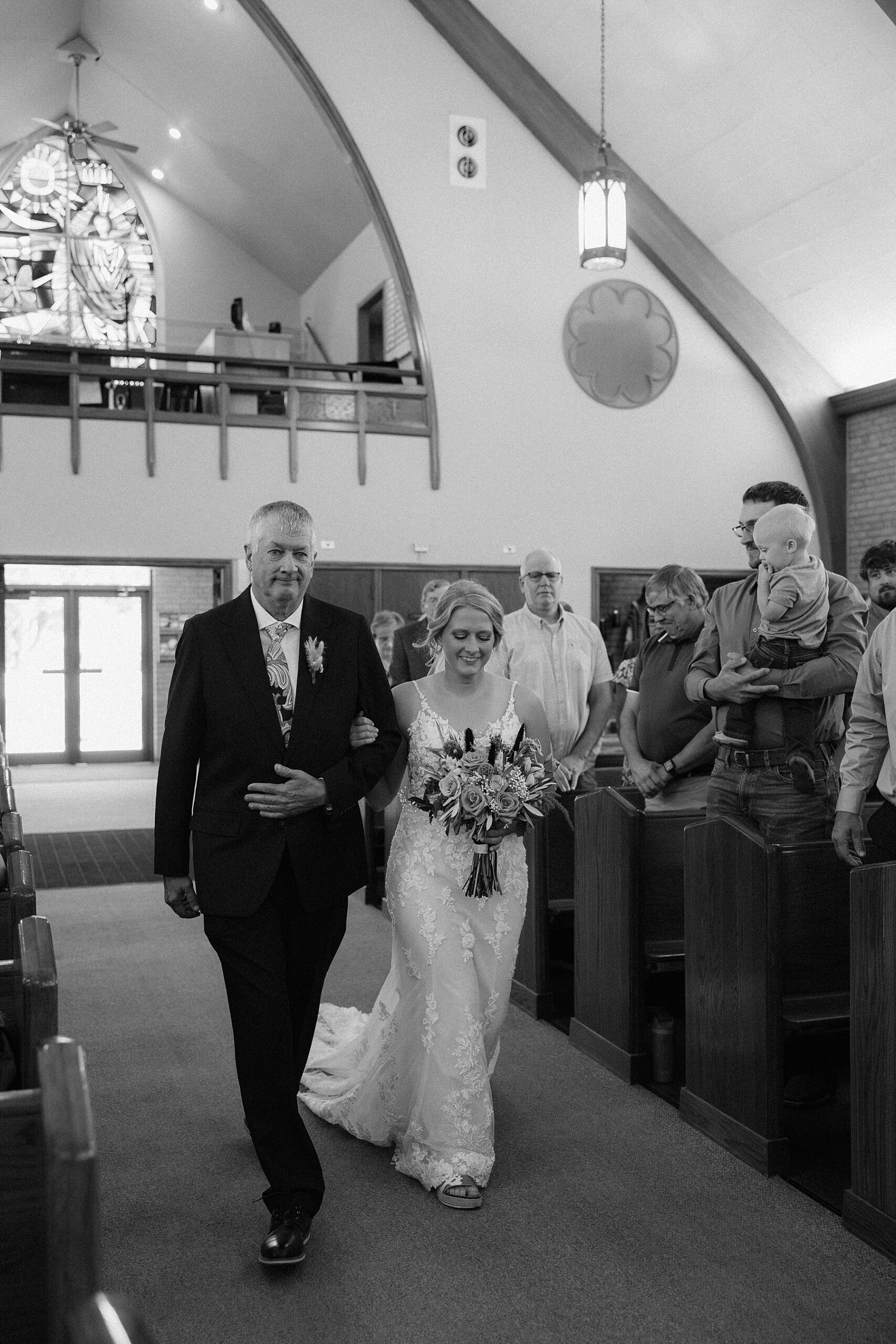 Bride walking down the aisle at St. Mary Catholic Church