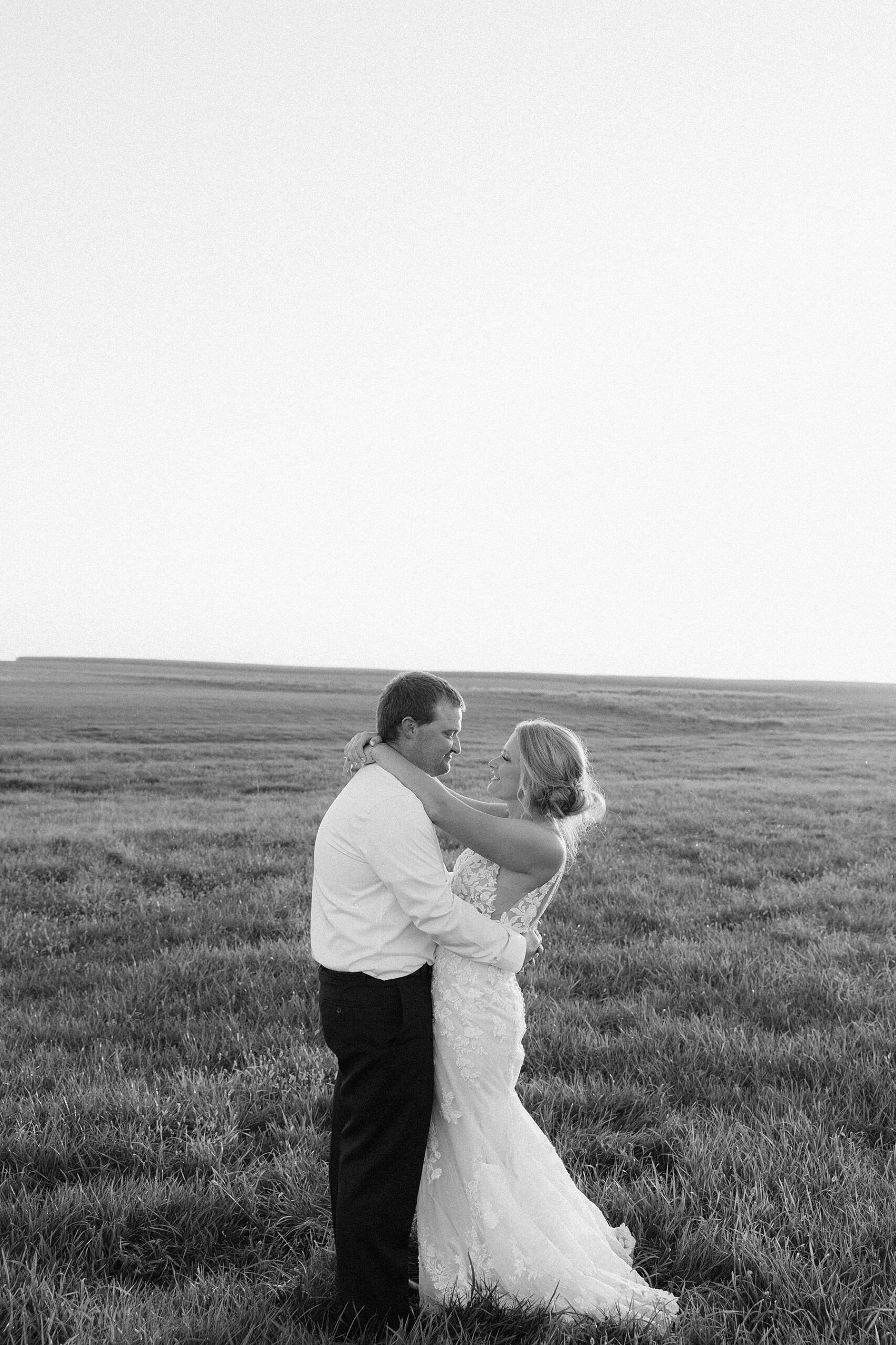 The bride and groom looking at each other.