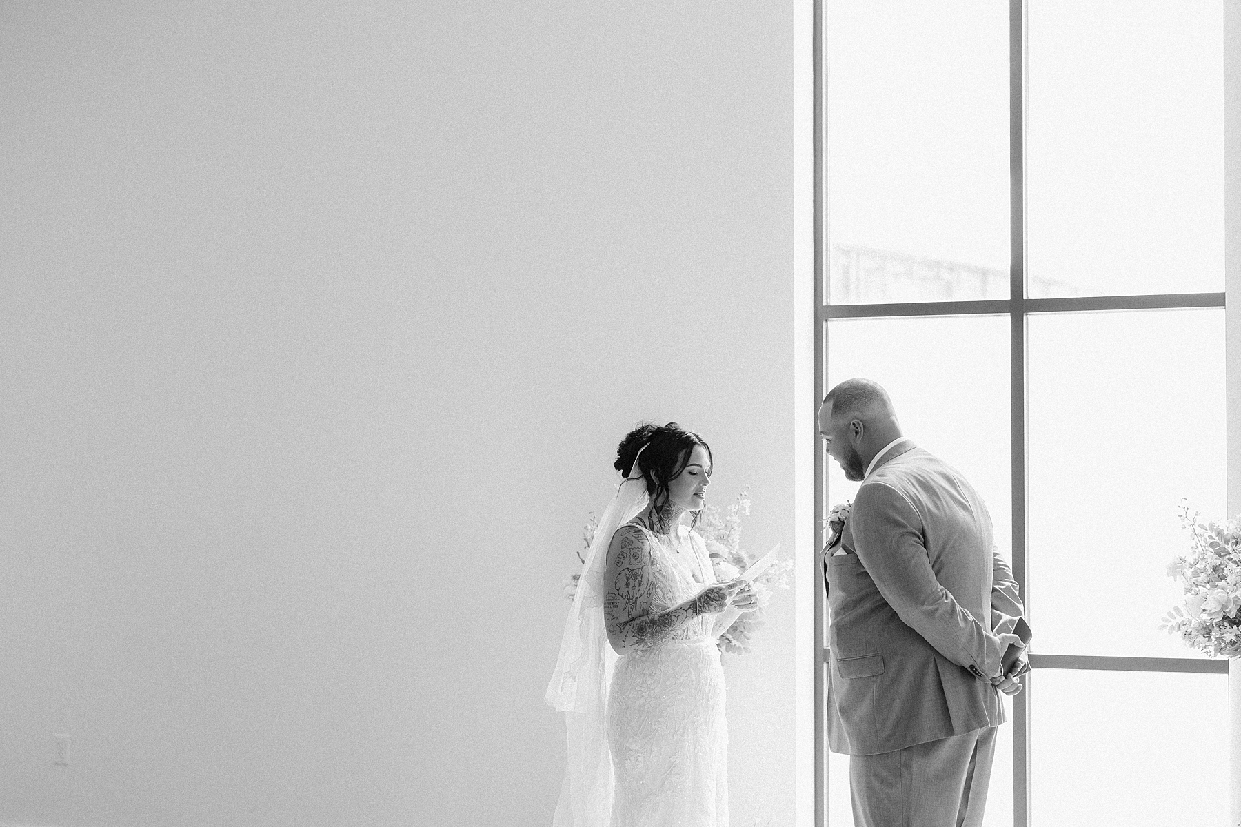 A couple reading private vows to each other before getting married in South Dakota.