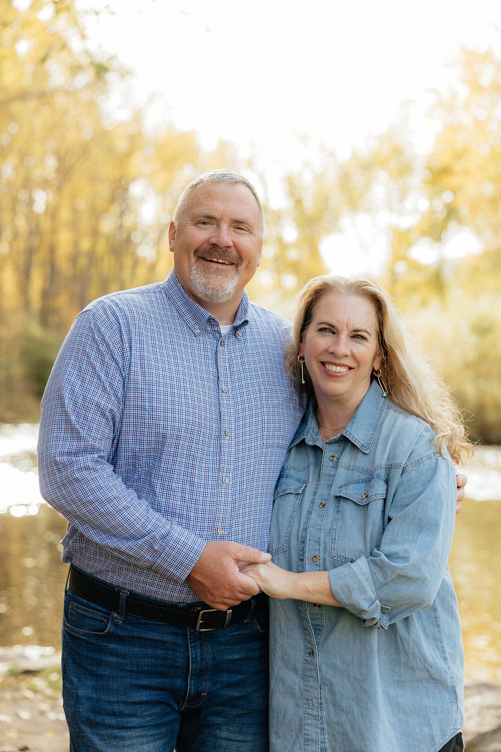 A couple smiling at the camera at Canyon Lake park in Rapid City.
