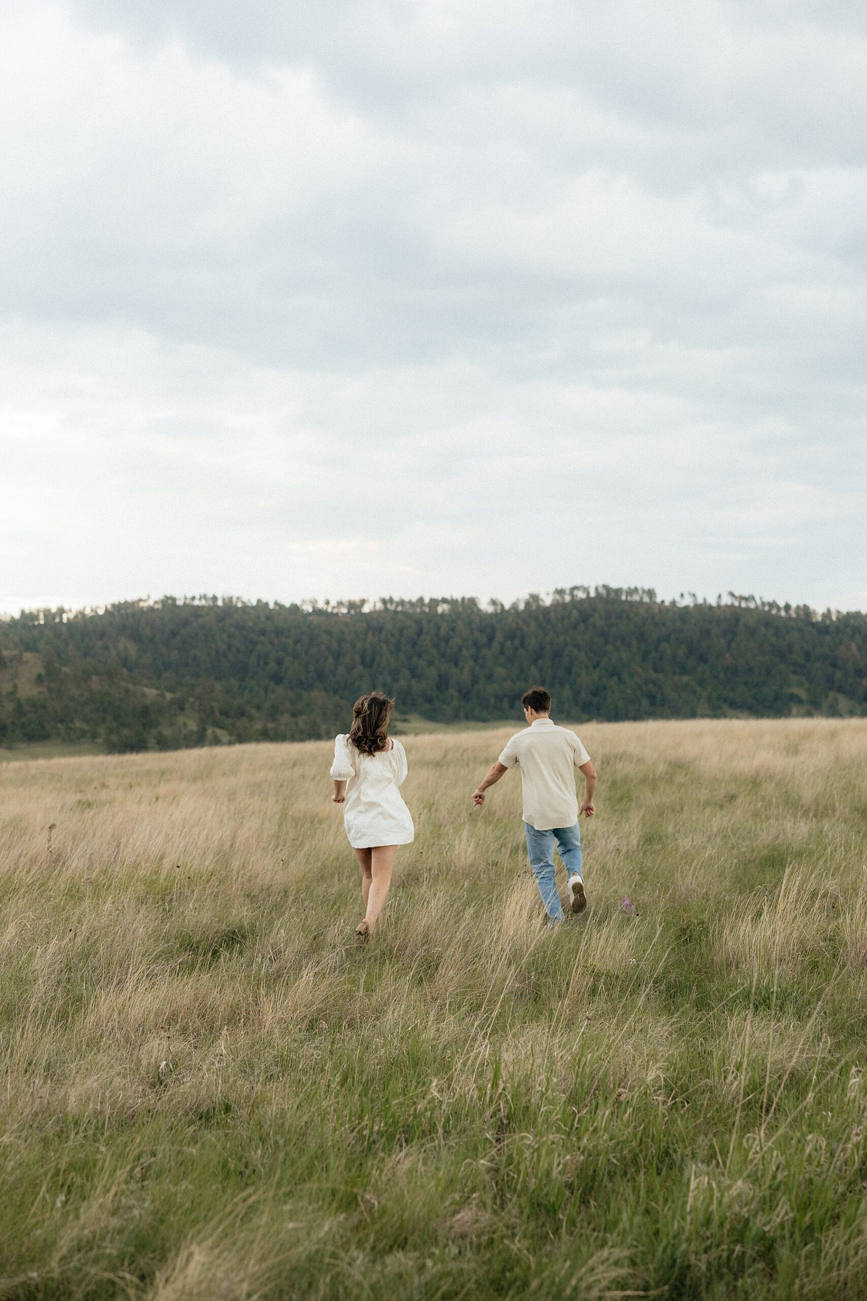 A couple running in Wind Cave National Park.