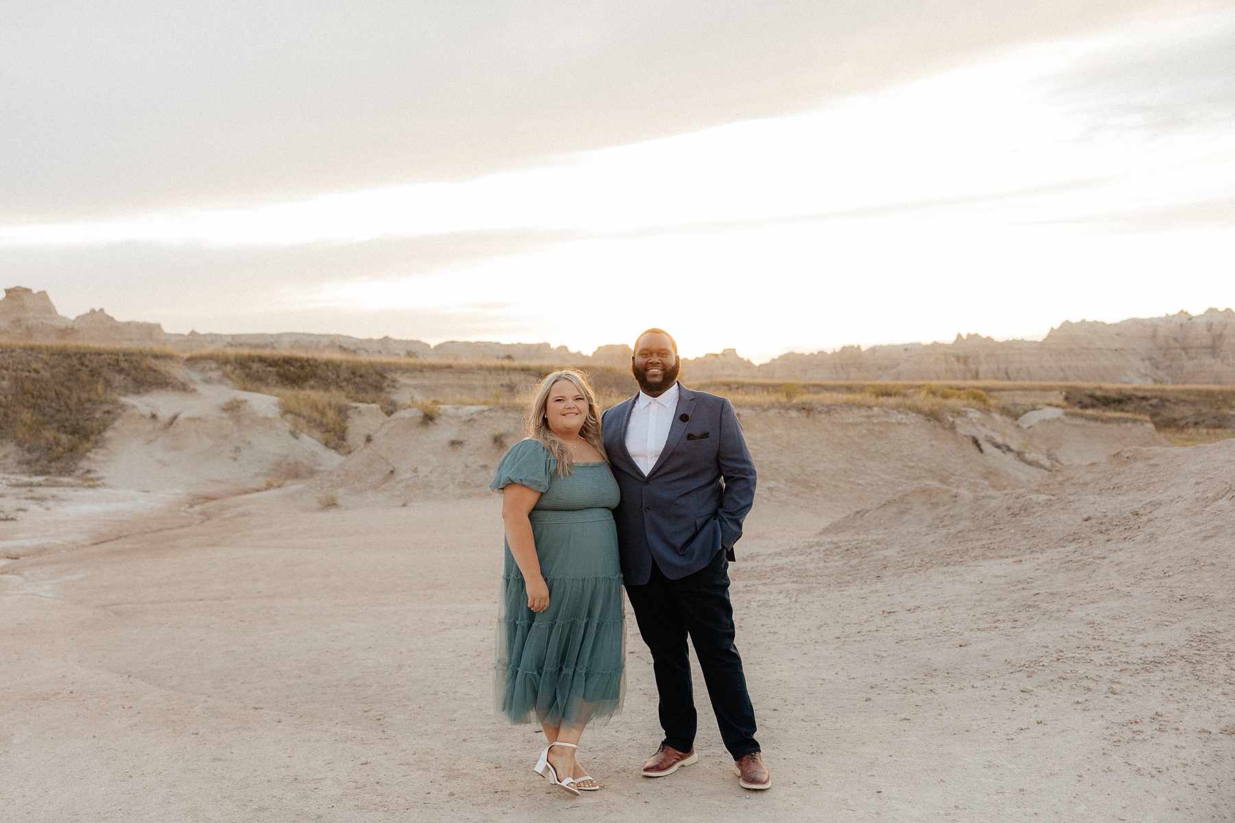 A couple smiling at the camera during their South Dakota engagement session.