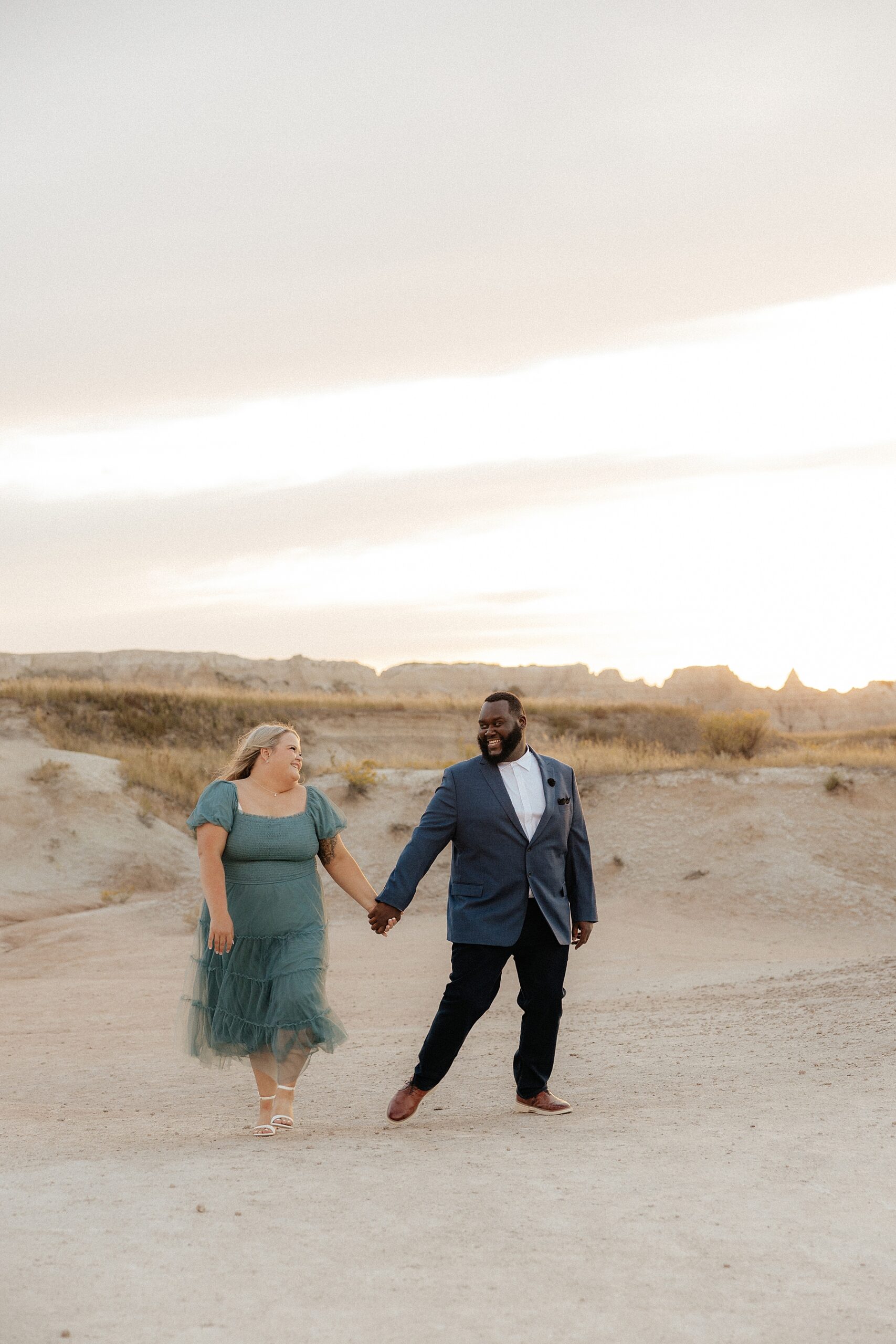 A couple walking on Castle Trailhead at Badlands National Park.