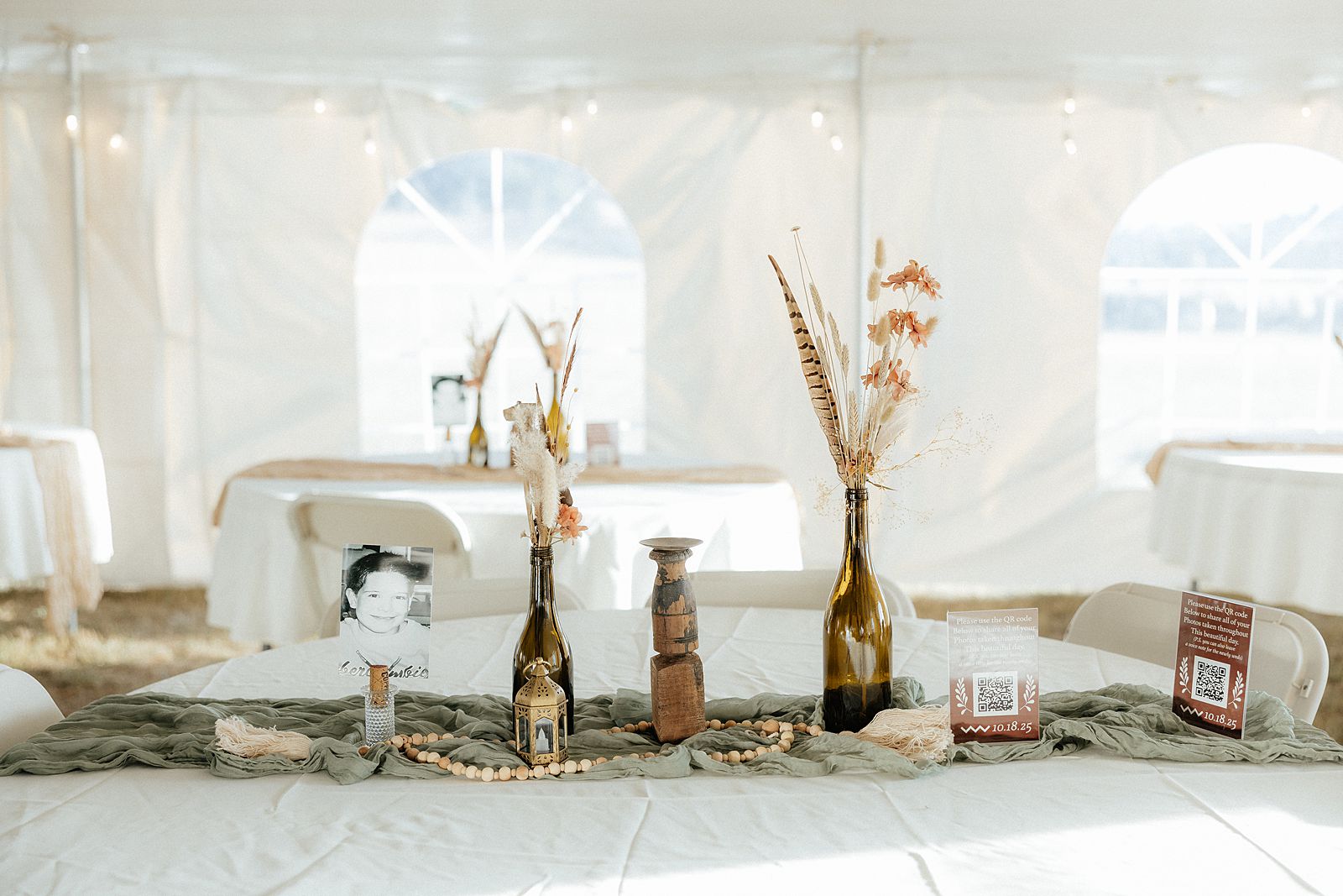 Bohemian table setting at a tent wedding reception.