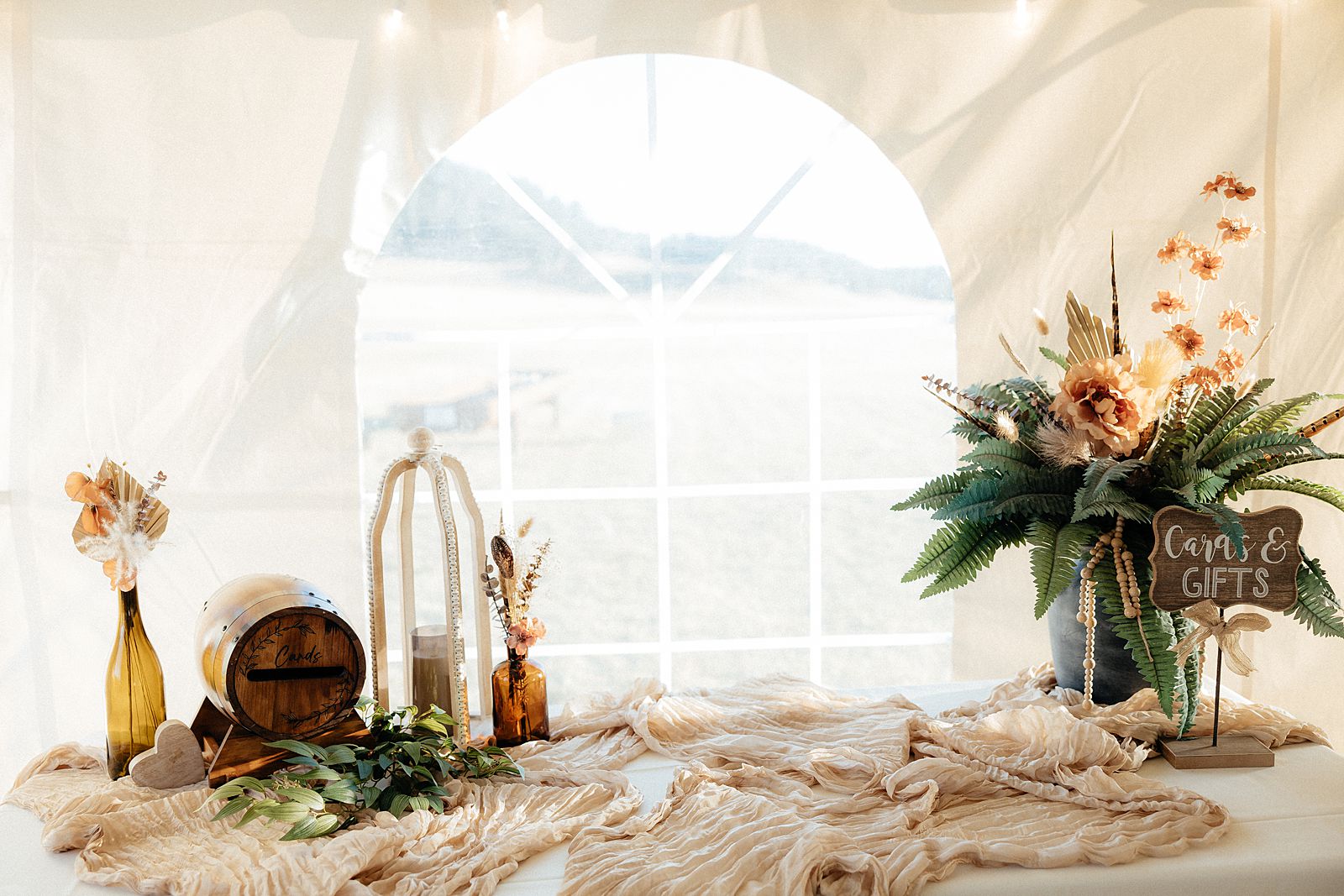 Bohemian wedding decor at a tent reception.