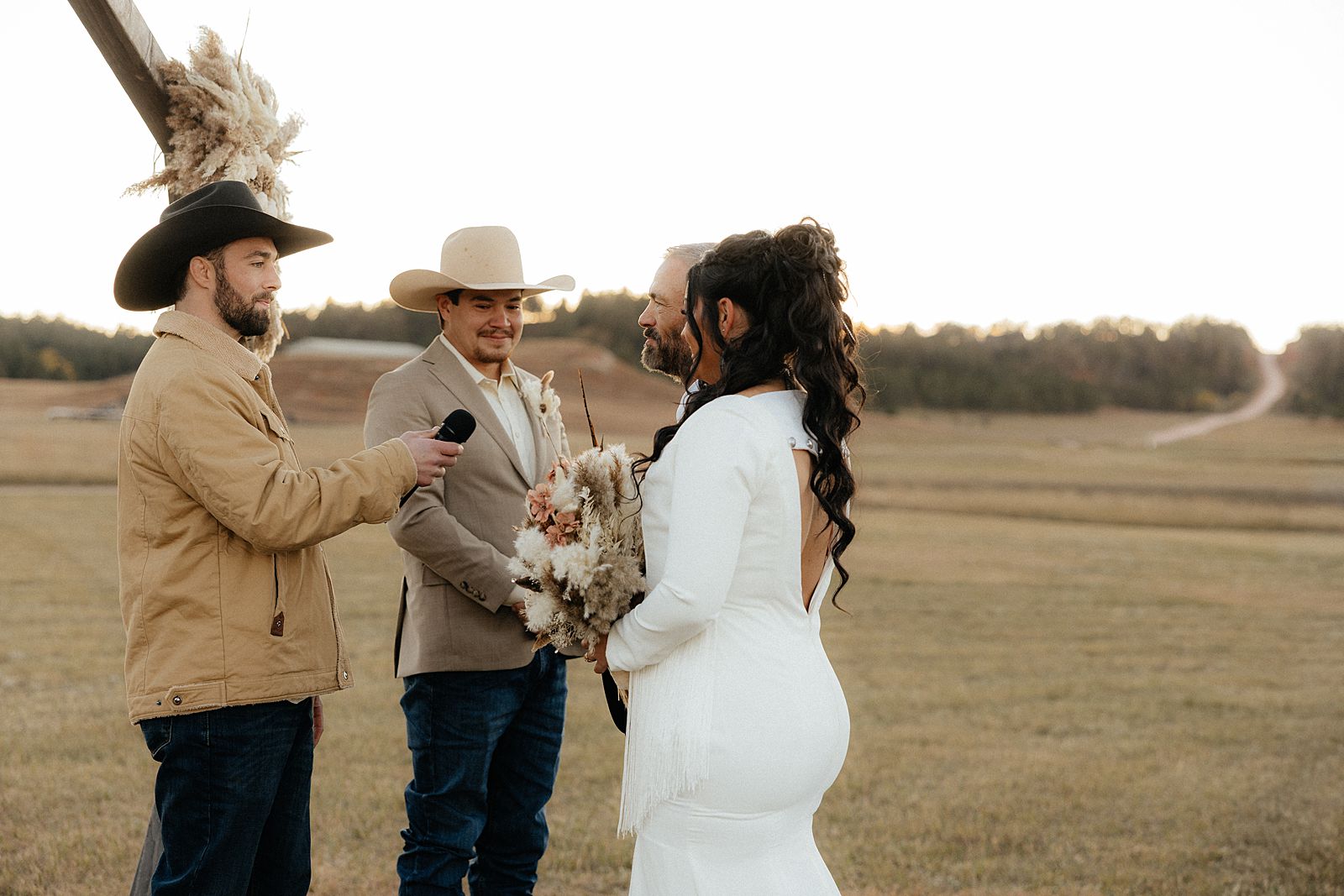 The father of the bride giving his daughter away at the alter.