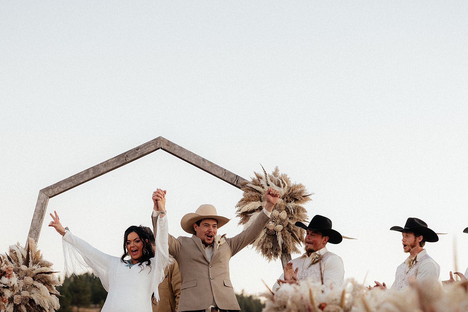 The bride and groom celebrating right after their ceremony.