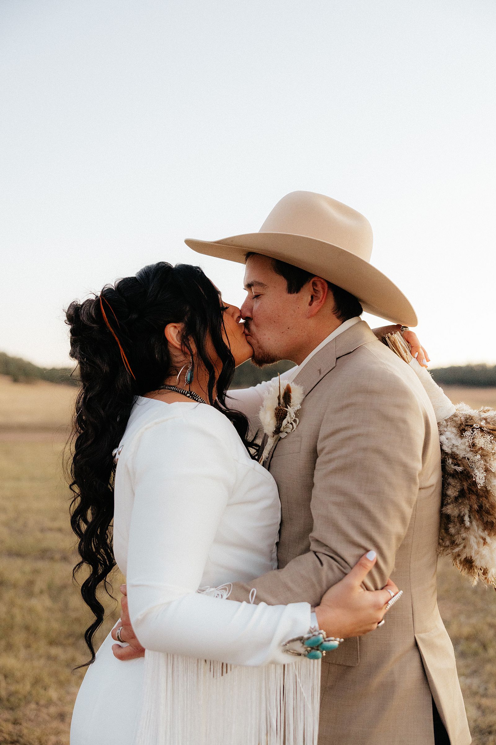 A couple kissing at their wedding at Battle Creek Camping Resort.