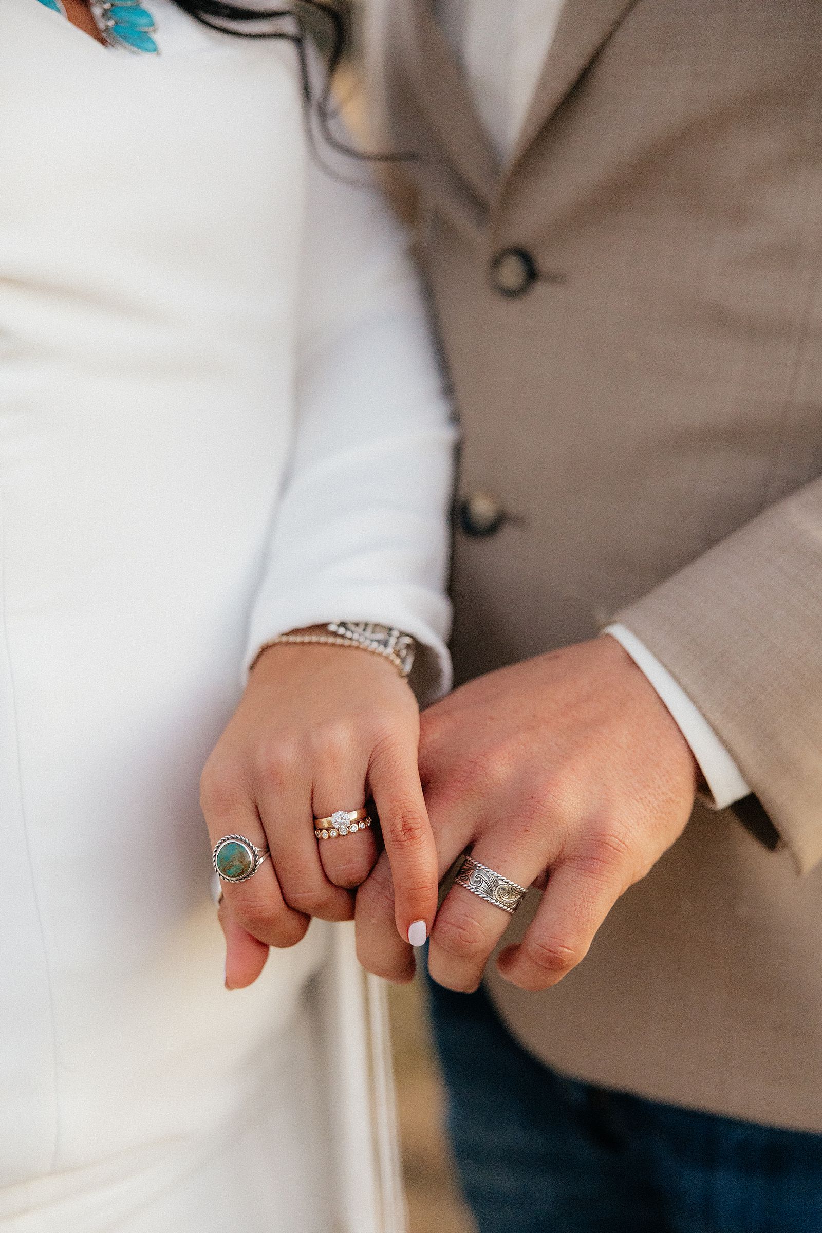 Tiernee and Nick showing off their wedding rings at their Battle Creek Camping Resort Wedding.