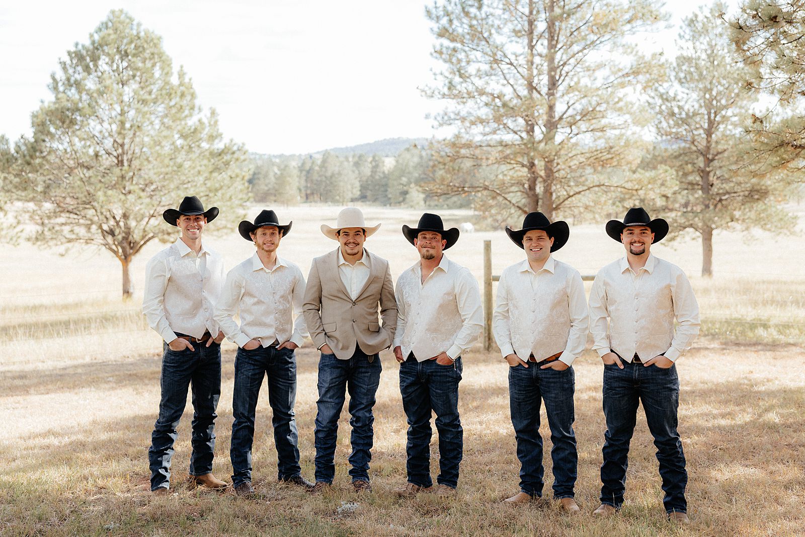 Groomsmen in white shirts and jeans at a Hermosa, South Dakota wedding.