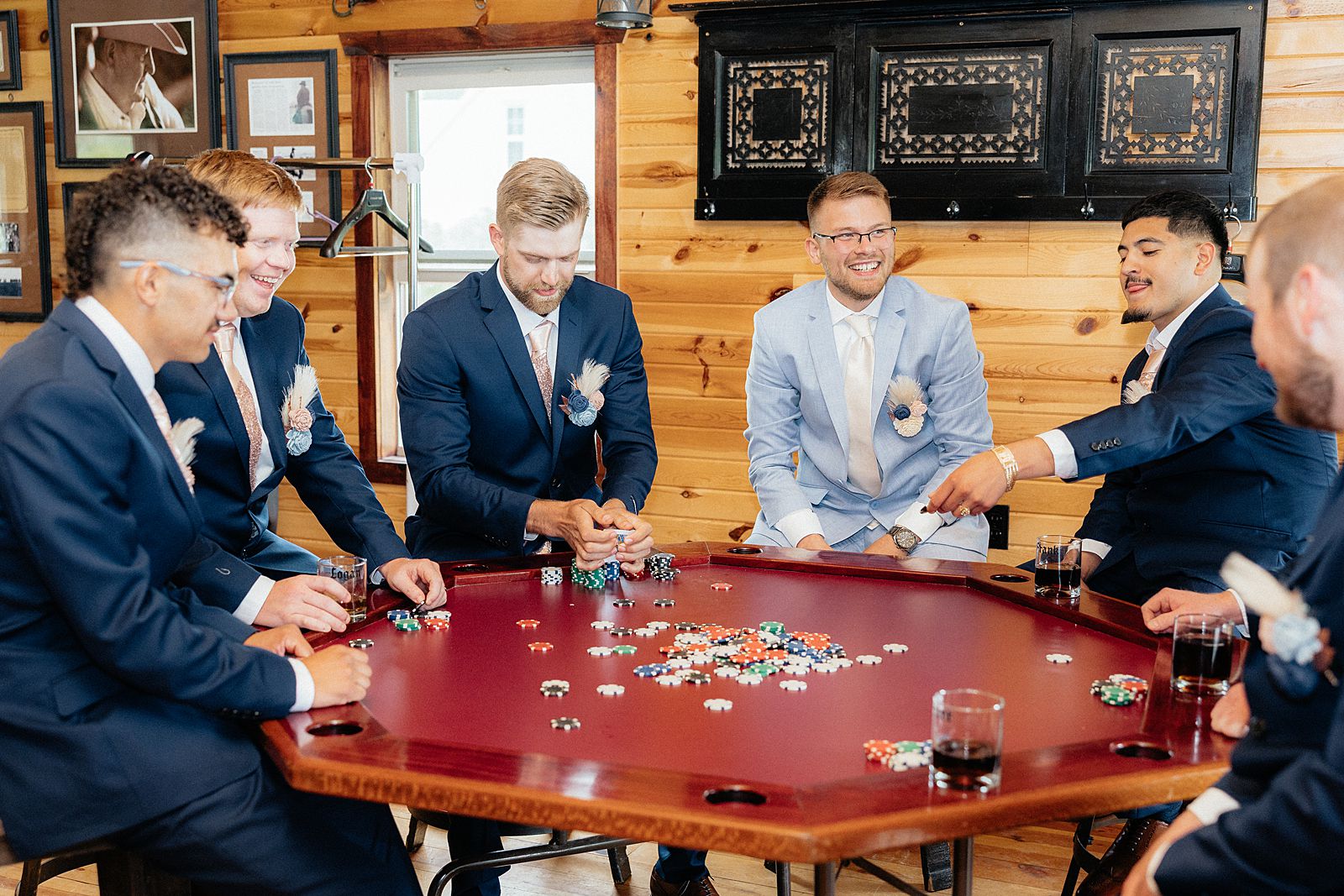 The groomsmen playing poker with the groom.