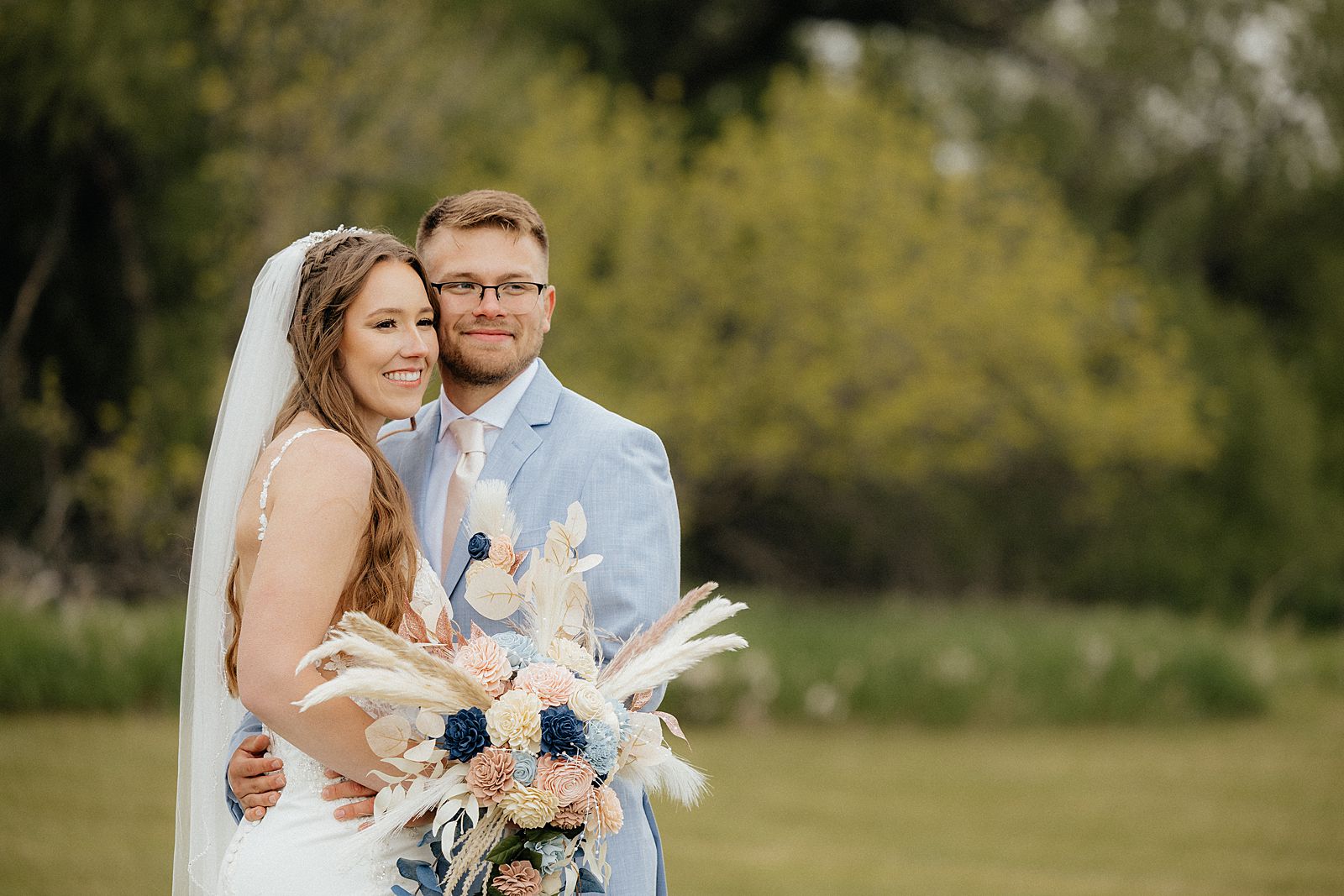 The Bride and Groom smiling.