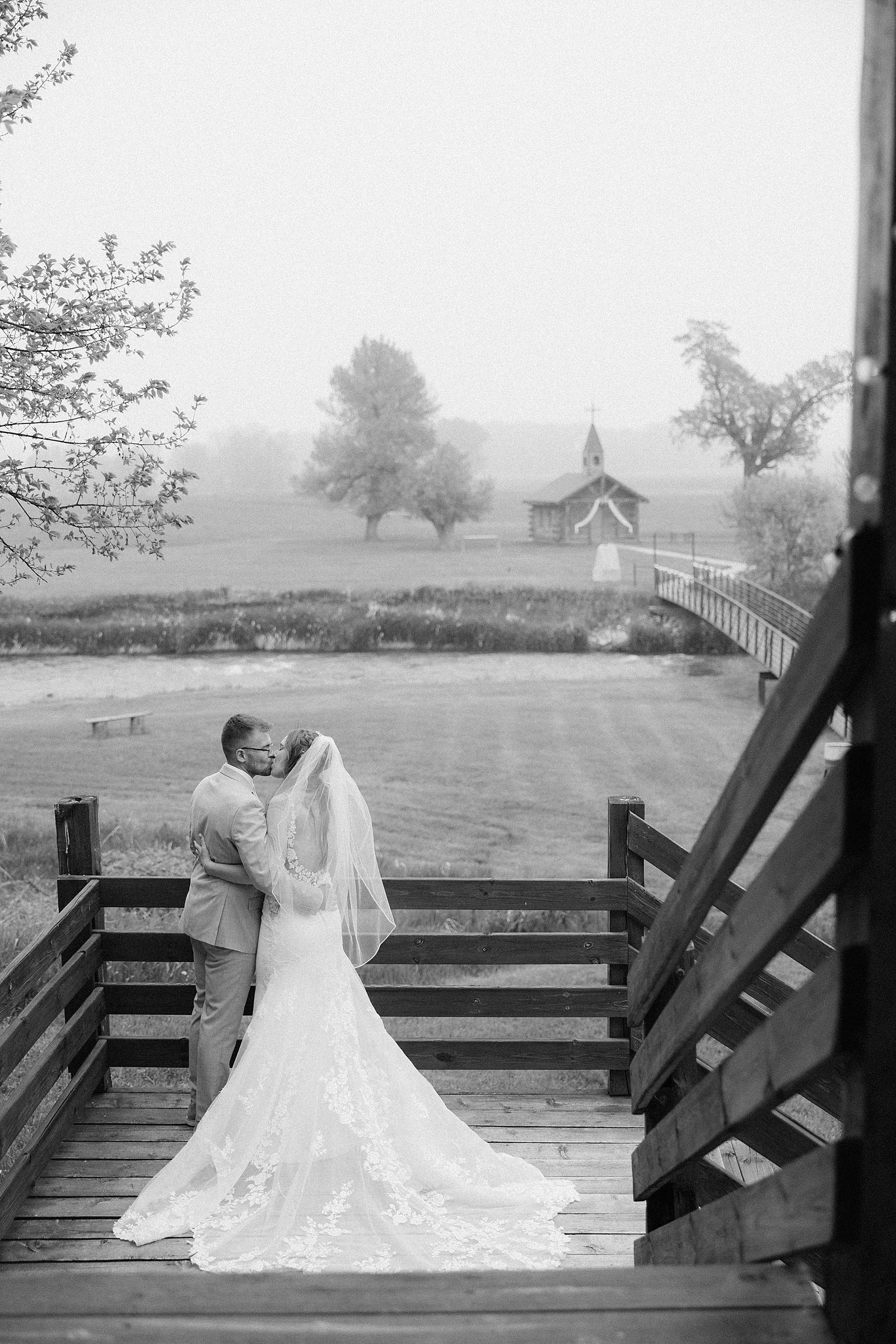The couple kissing on the stairs at Besler's Cadillac Ranch in St. Ogna, South Dakota.