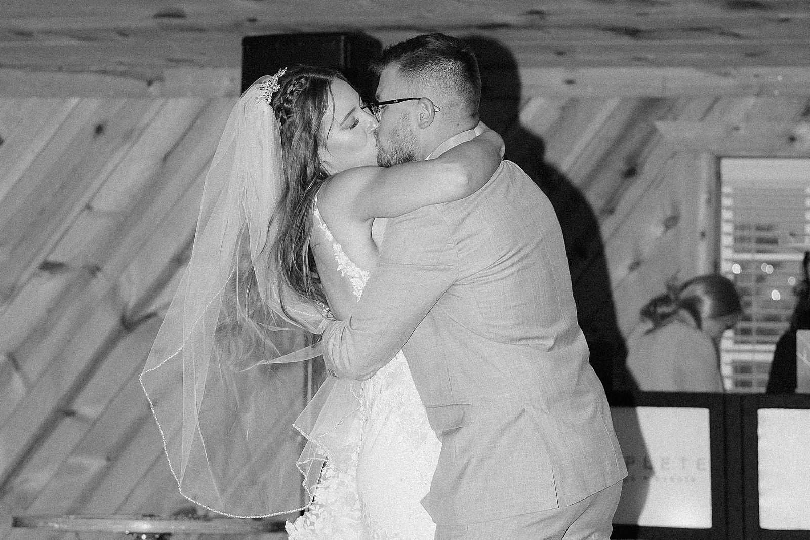 The bride and groom kissing during the first dance.