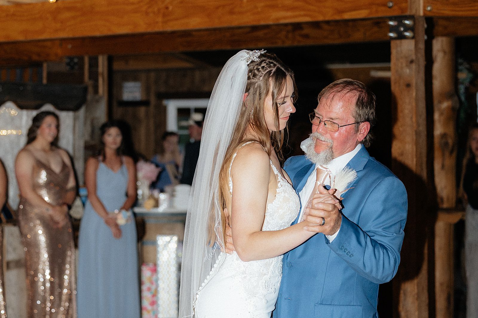 The bride dancing with her step-father.
