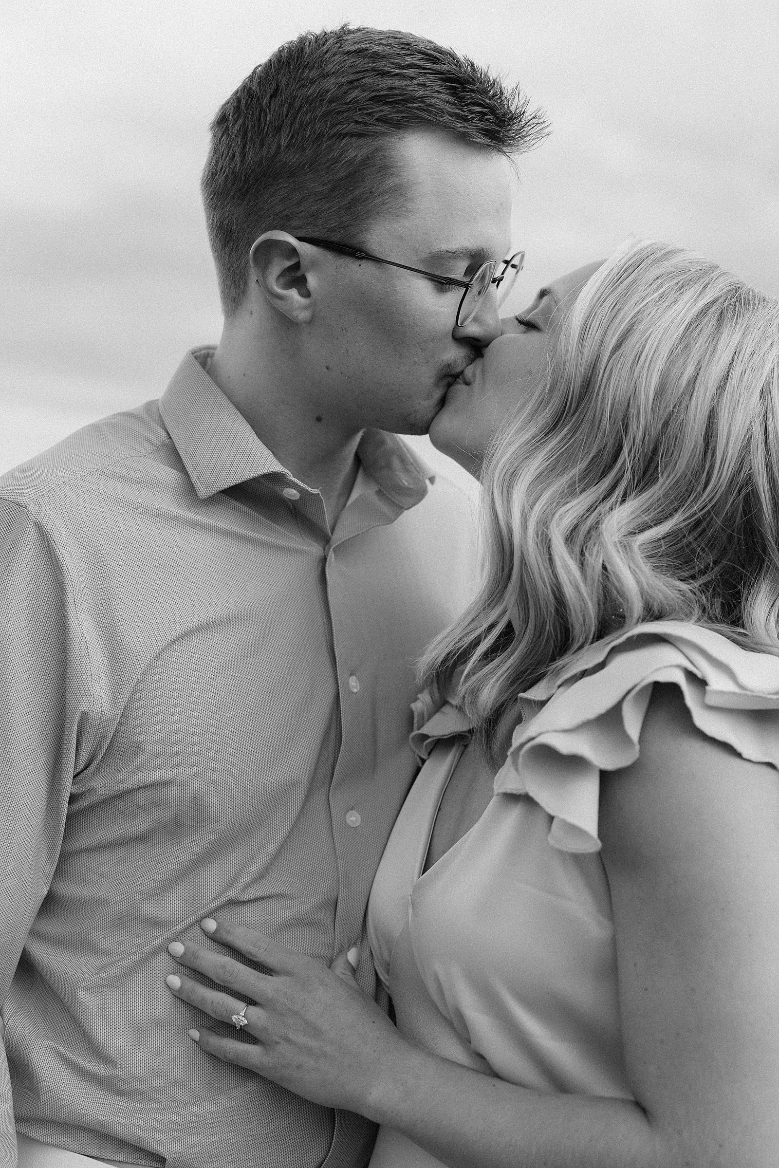 A couple kissing during their engagement session.