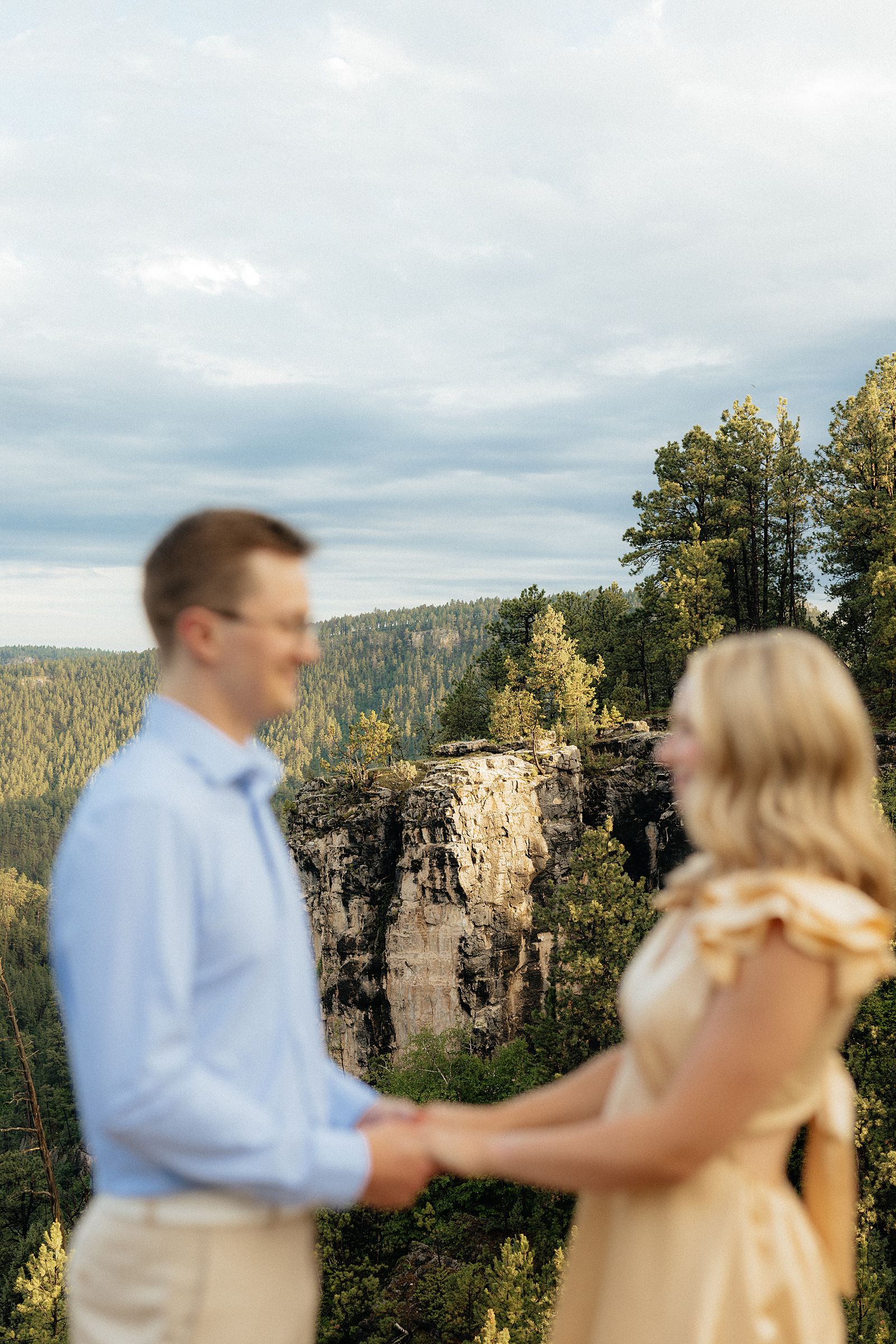 Devin and Avery standing like they will at the alter.