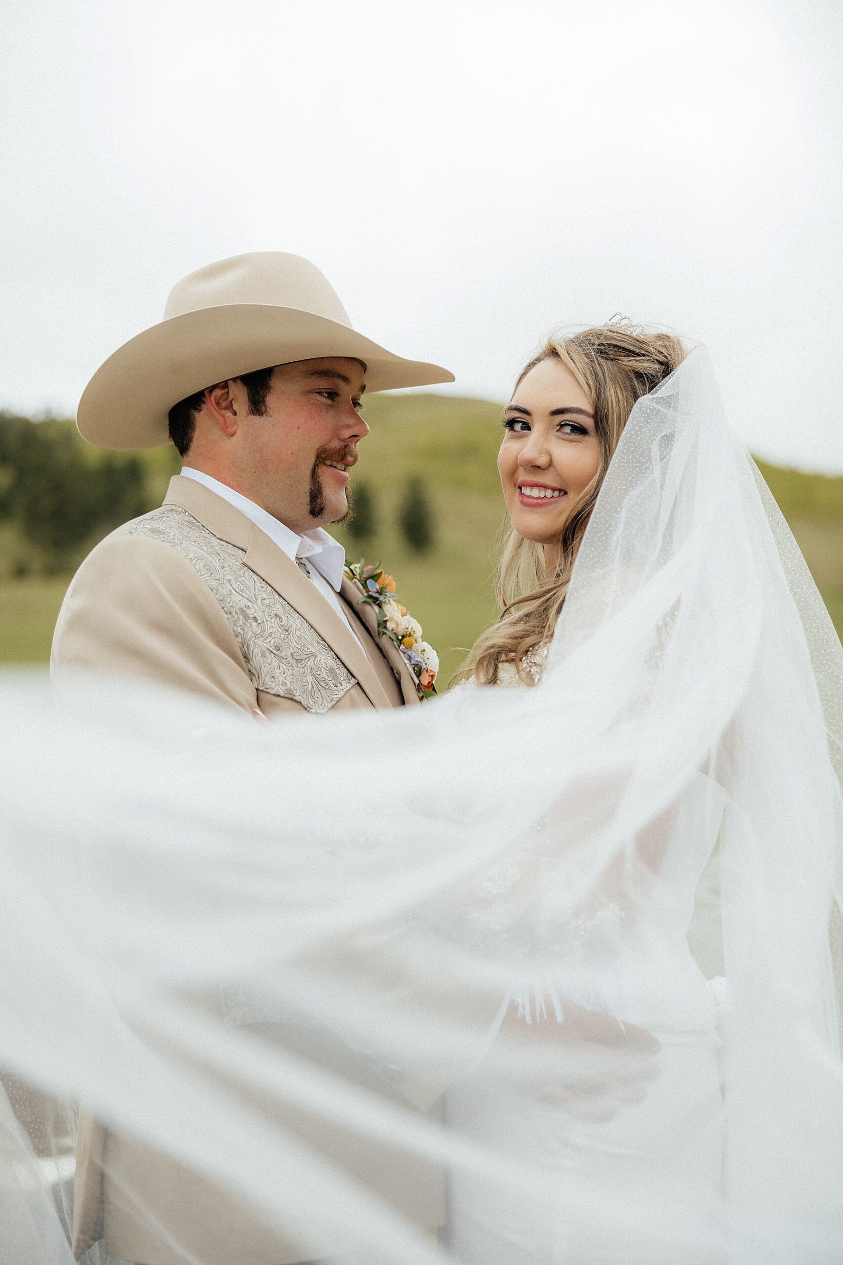 The bride and groom during portraits. Photos taken by a South Dakota wedding photographer.