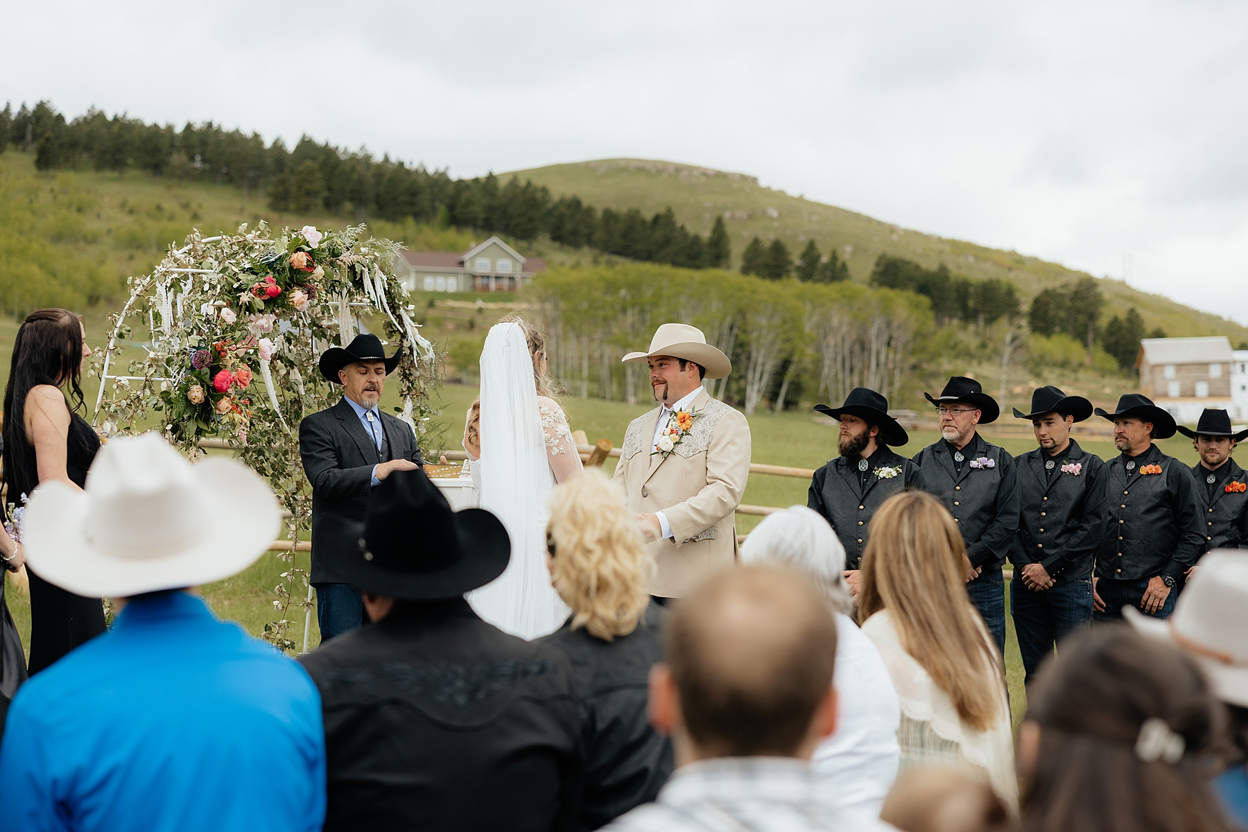The bride and groom at their ceremony space at Muley Hill lodge.
