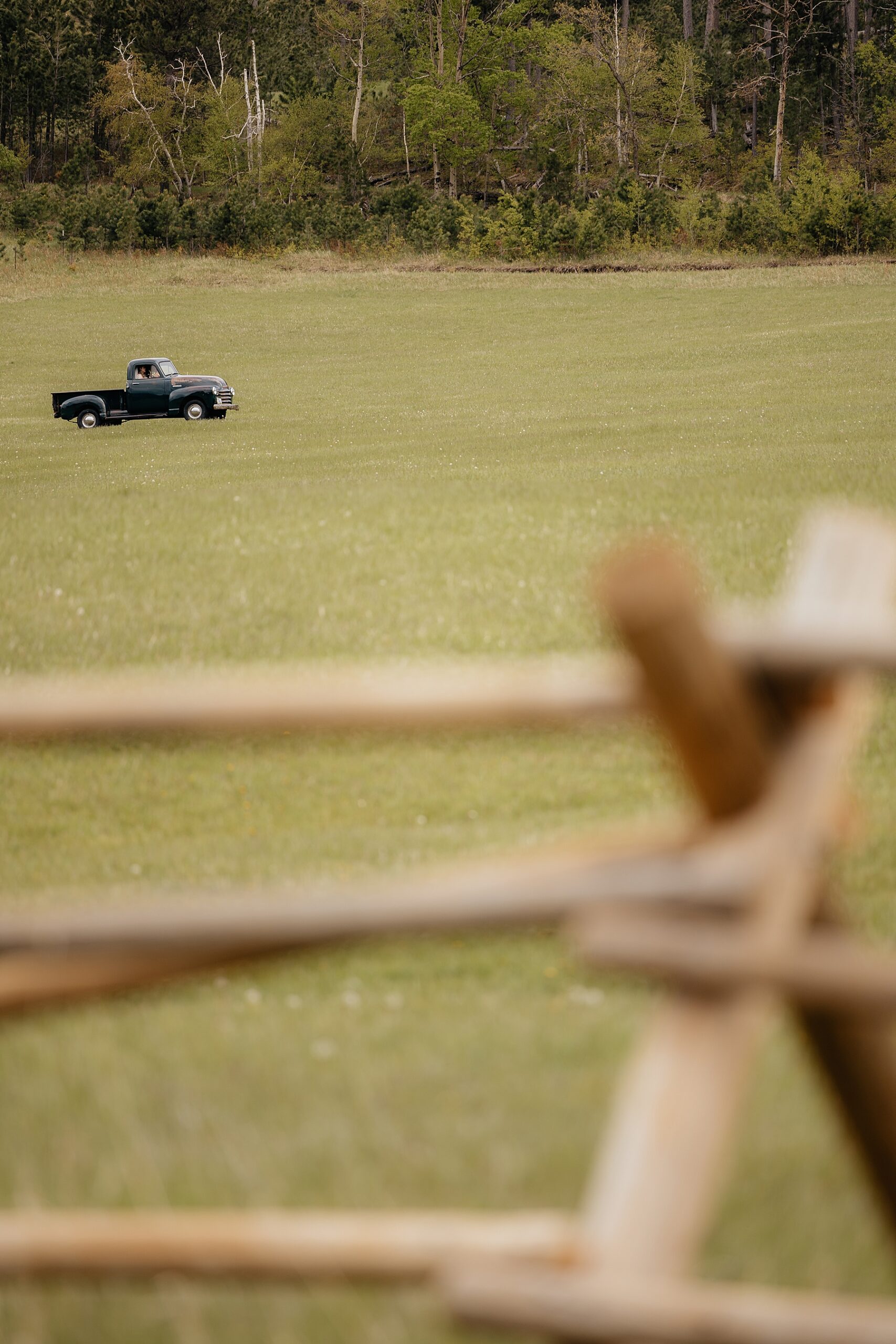 Vintage Chevrolet truck driving the bride to the ceremony space.