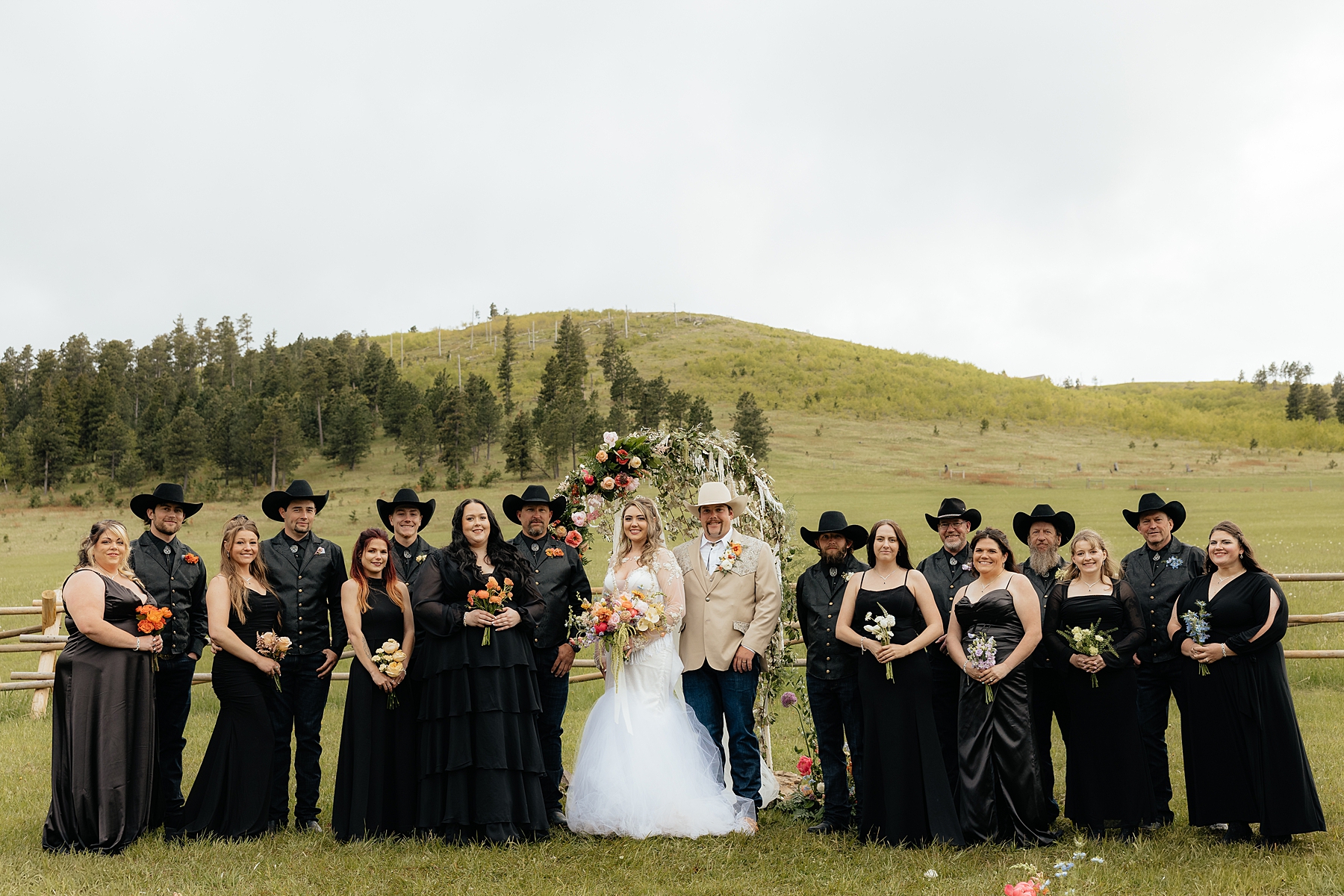 The wedding party at the ceremony space at Muley Hill Lodge.