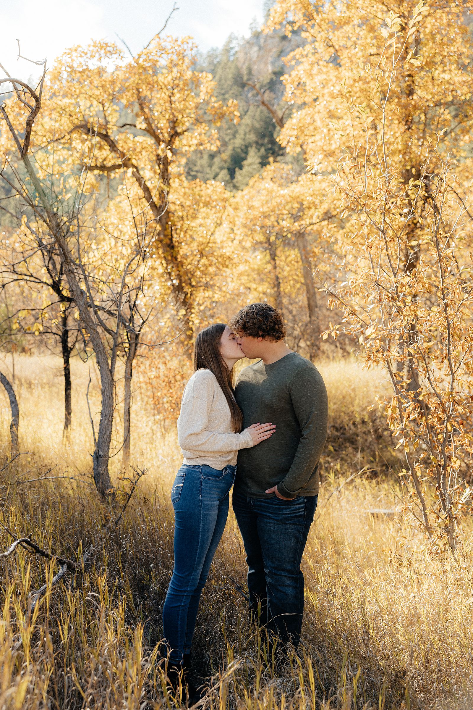 Hannah and Parker kissing at their engagement session.